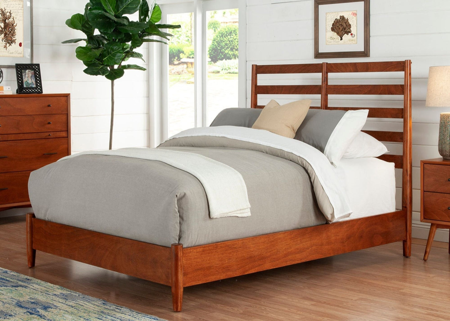 Flynn Retro Bed in Chestnut finish with slat back headboard and taper legs in a modern bedroom setting.