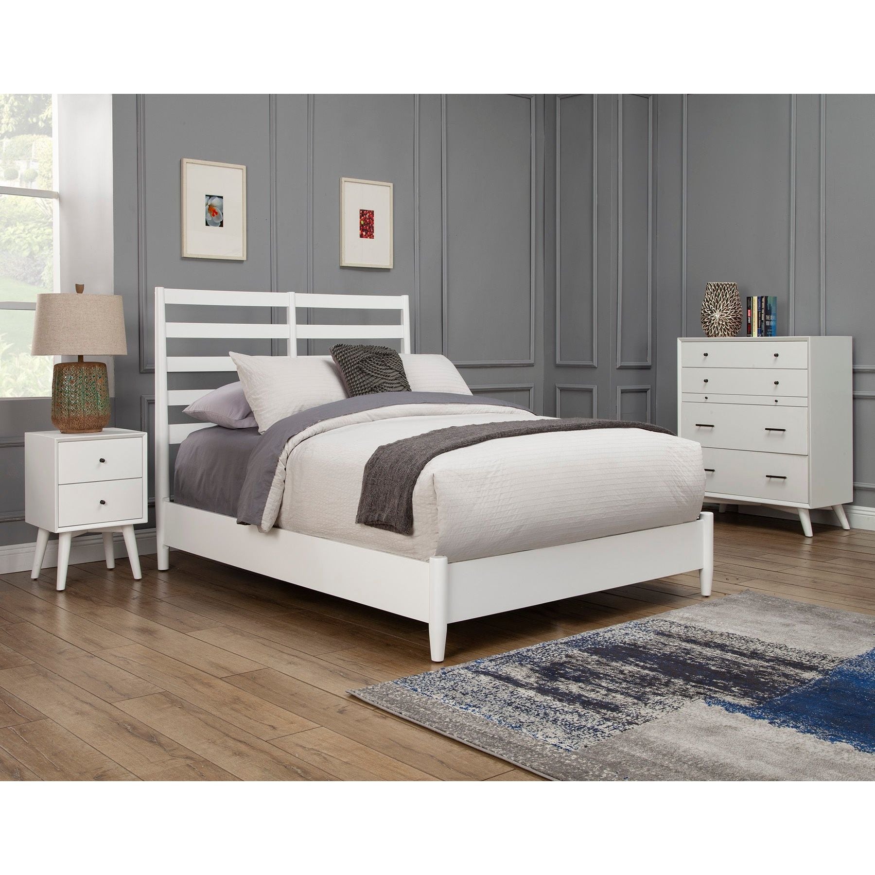 A stylish Flynn Retro Bed in white with slat back headboard, surrounded by modern bedroom furniture.