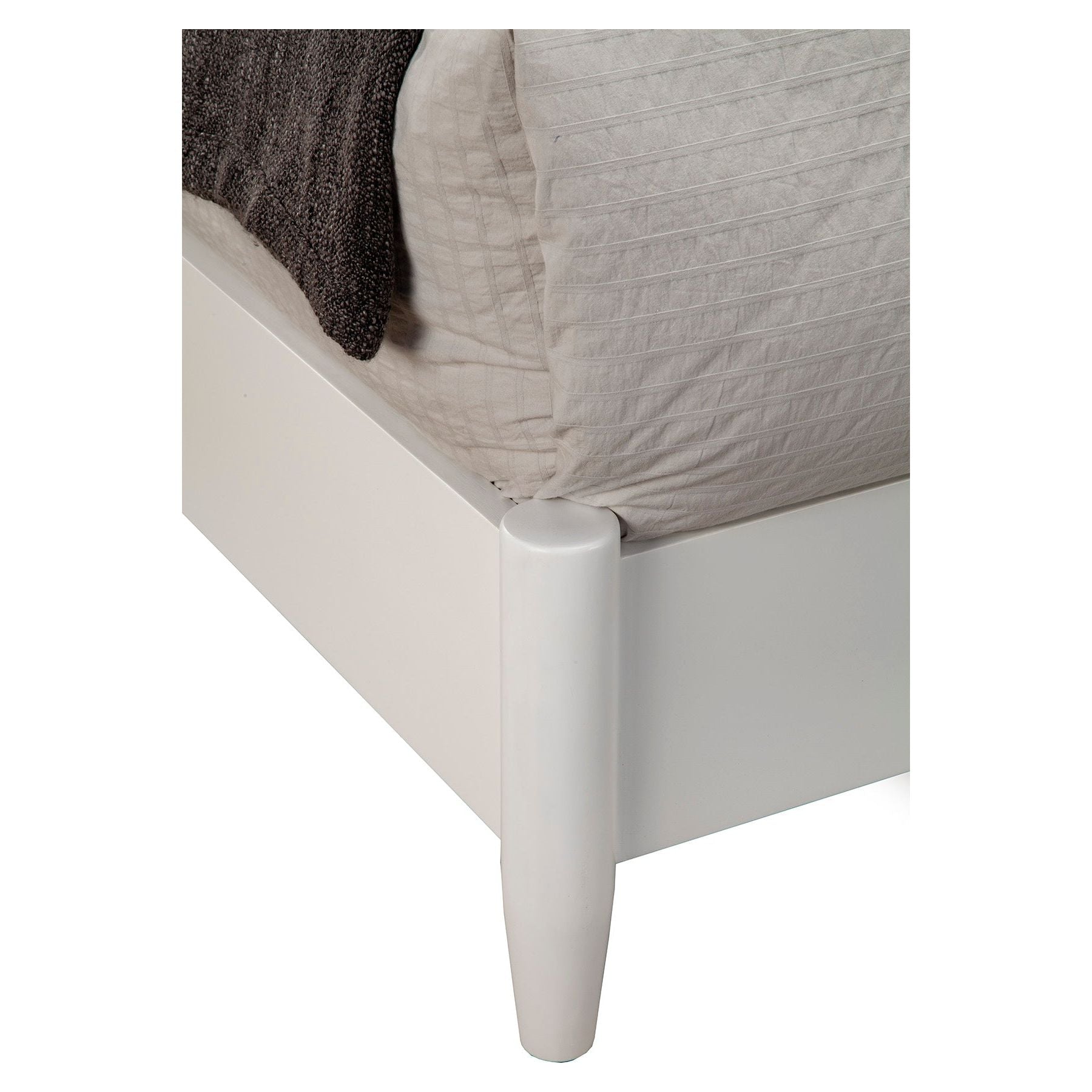 Flynn Retro Bed corner detail showcasing the sleek white finish and tapered legs for a modern look.