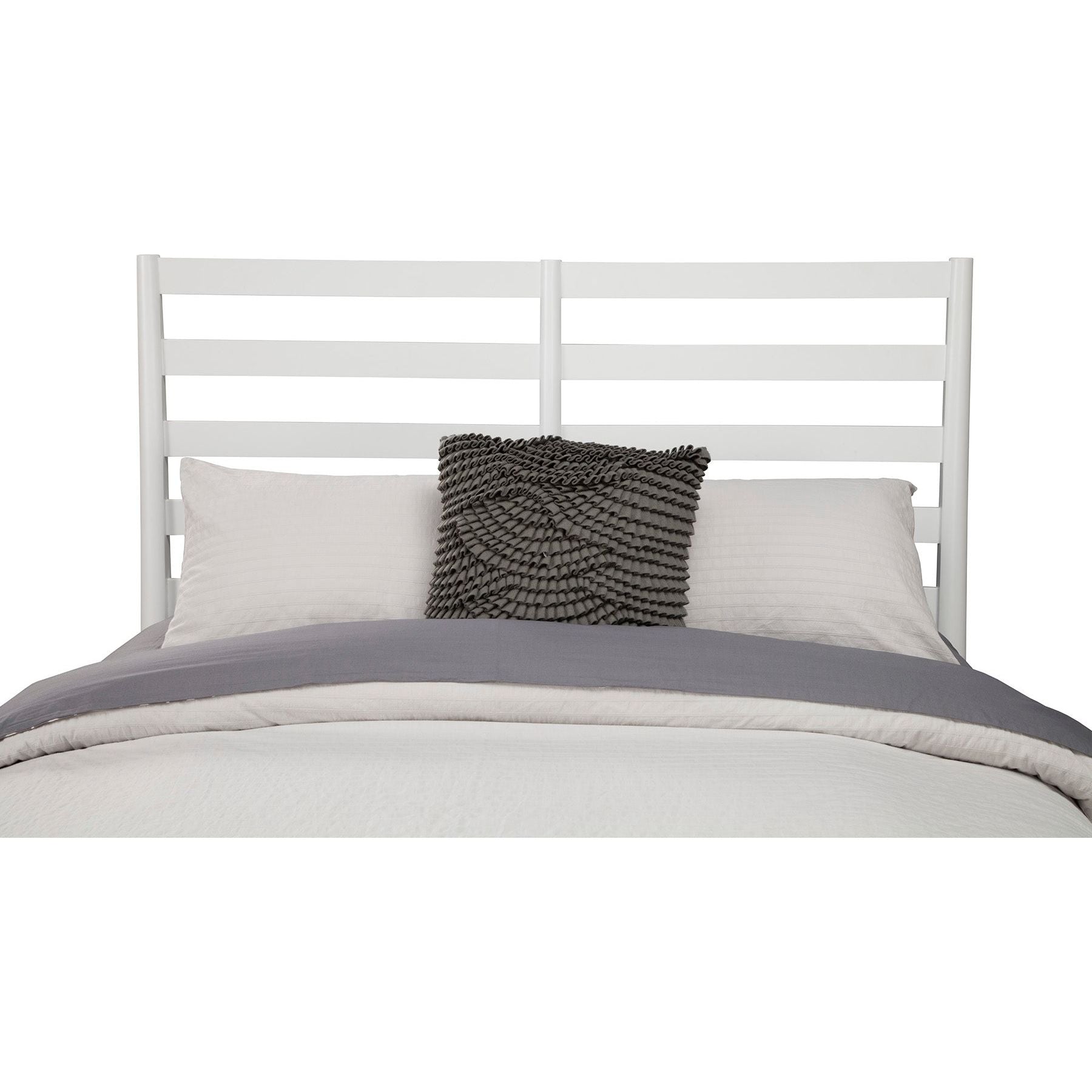 Flynn Retro Bed with a white slat back headboard and stylish bedding in a modern bedroom setting.