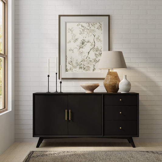 Flynn Sideboard in Black displayed in a modern living space with decor accents and natural light.