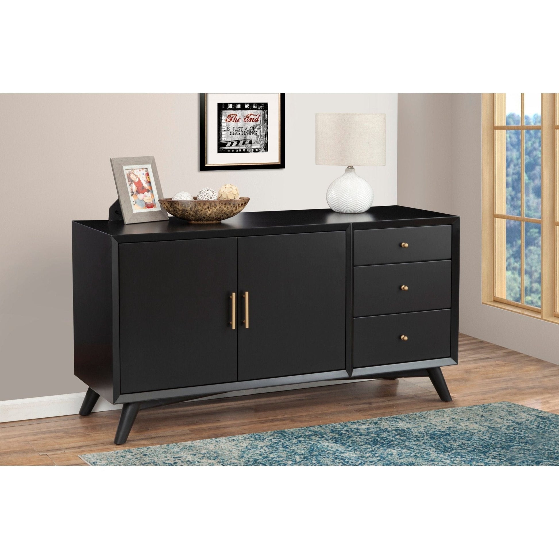 Flynn Sideboard in black, showcasing its sleek design, drawers, and elegant finish in a modern living space.