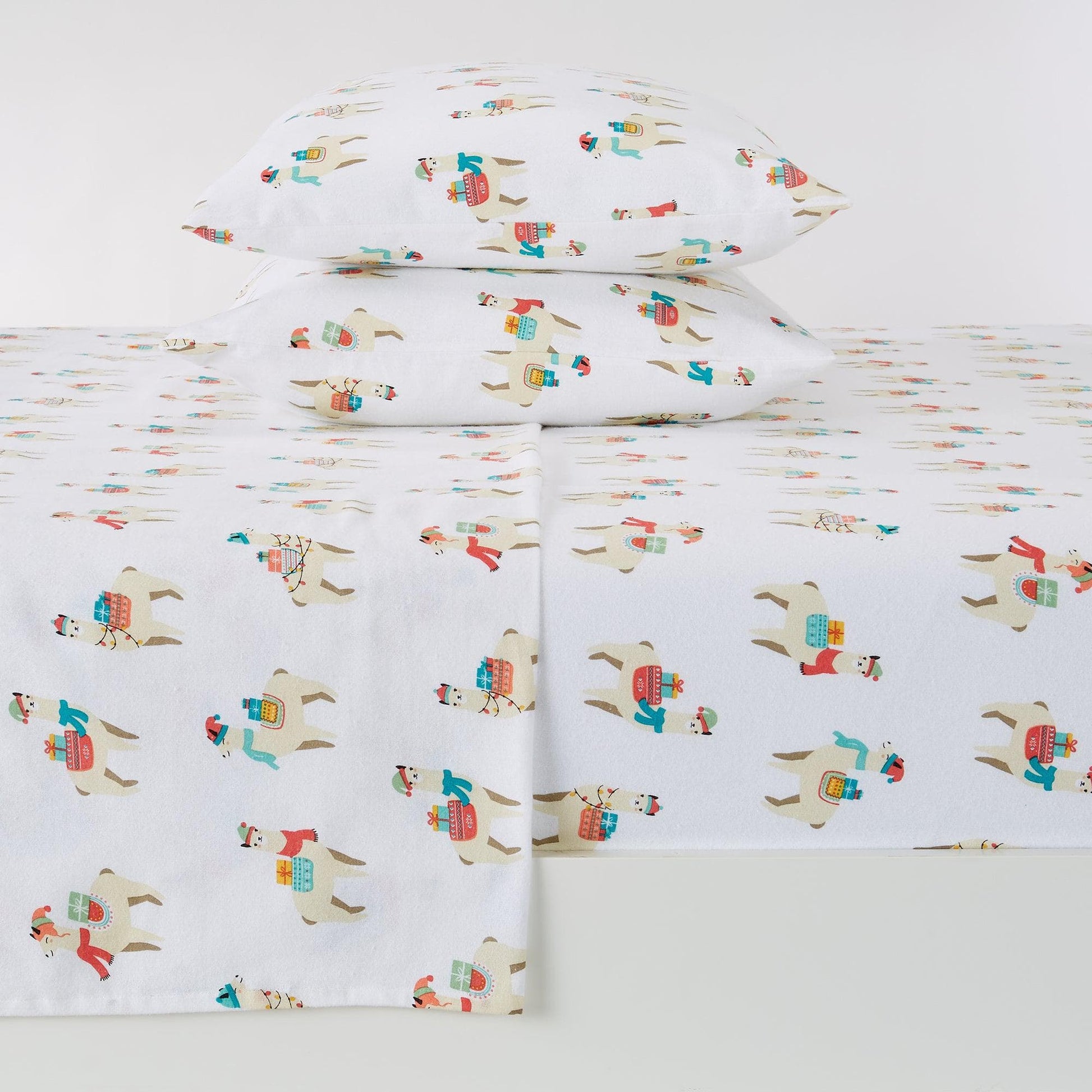 Children's bedding set with llama design on a white background