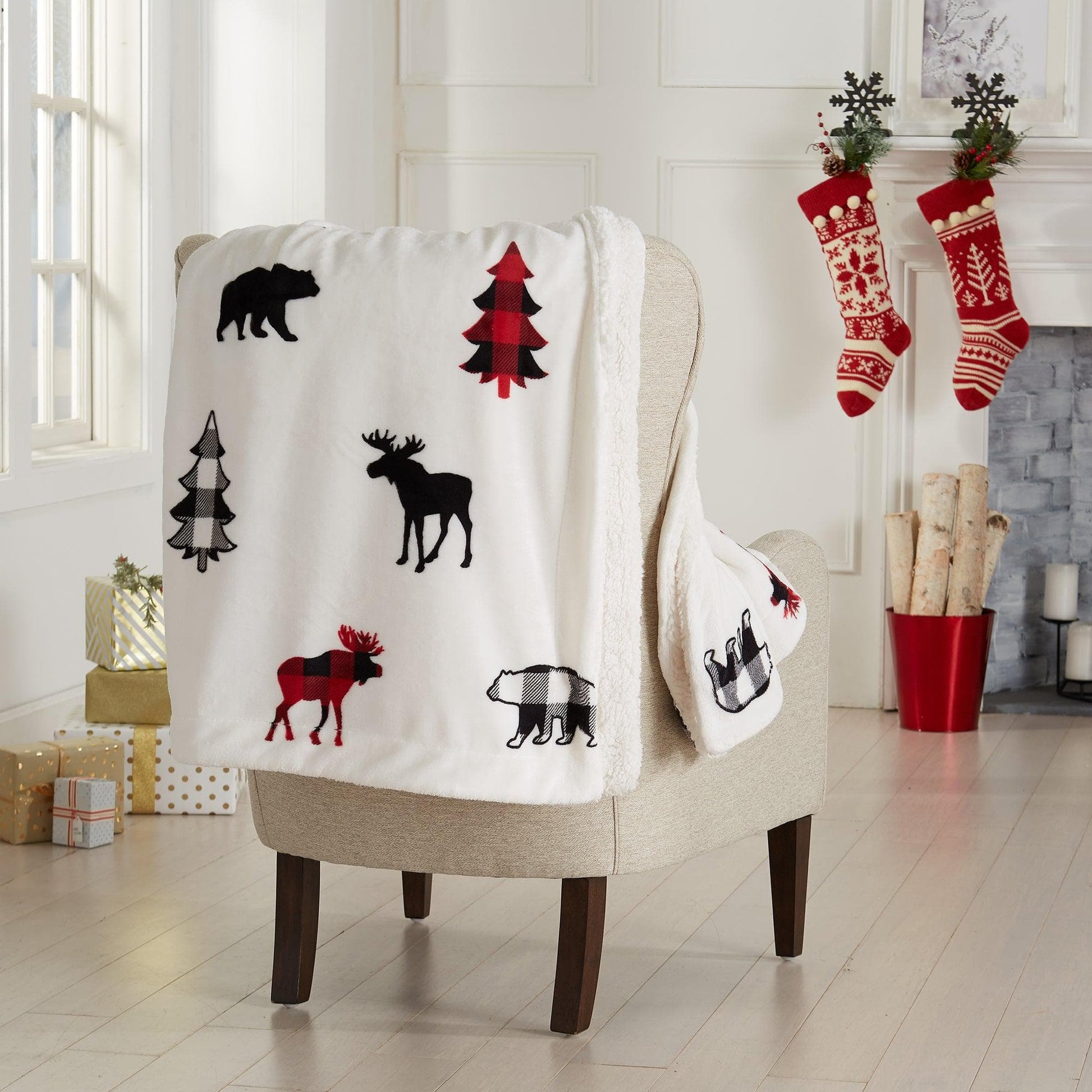 Decorative blanket with animal patterns draped over a chair in a festive room.