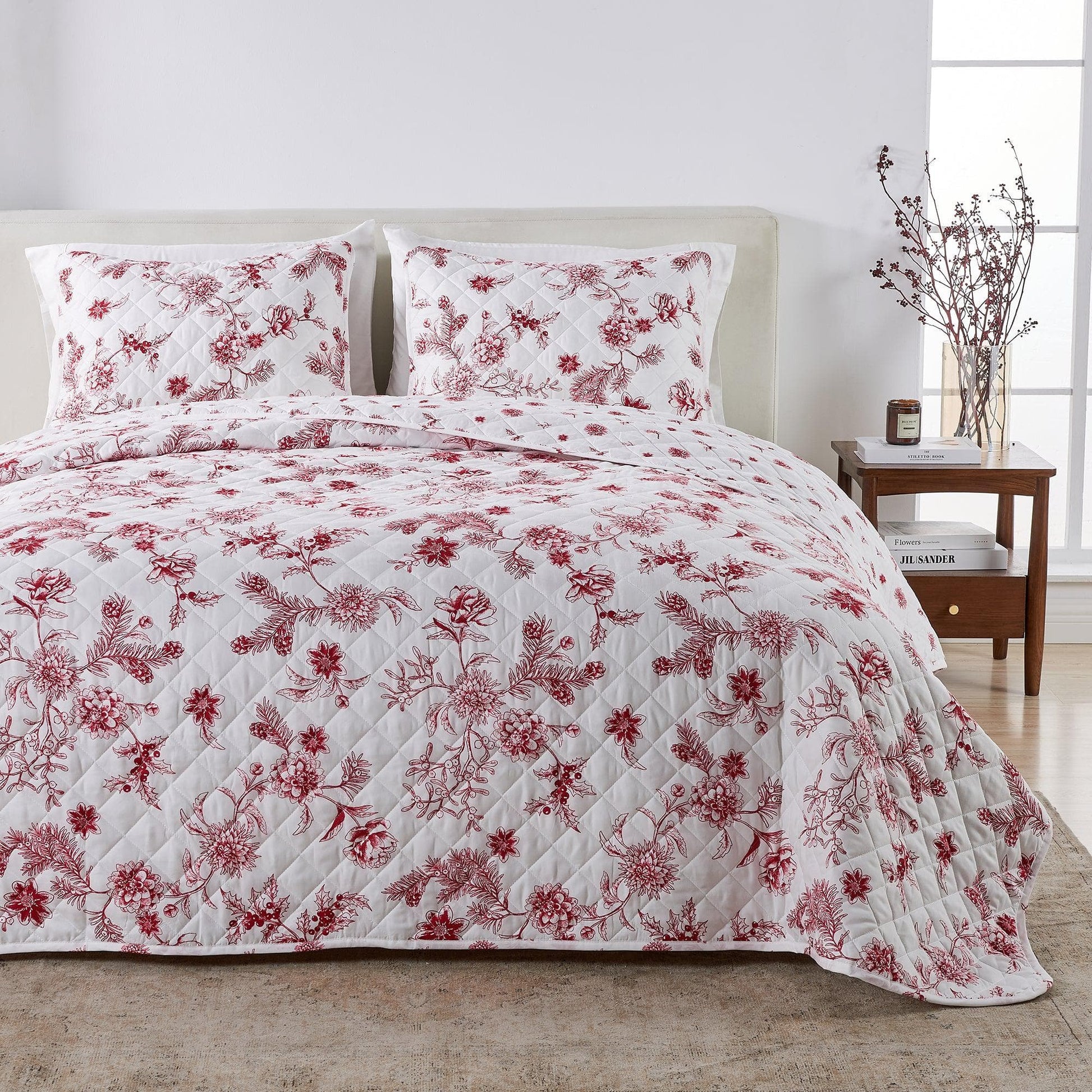Floral quilt set on a bed in a bedroom setting