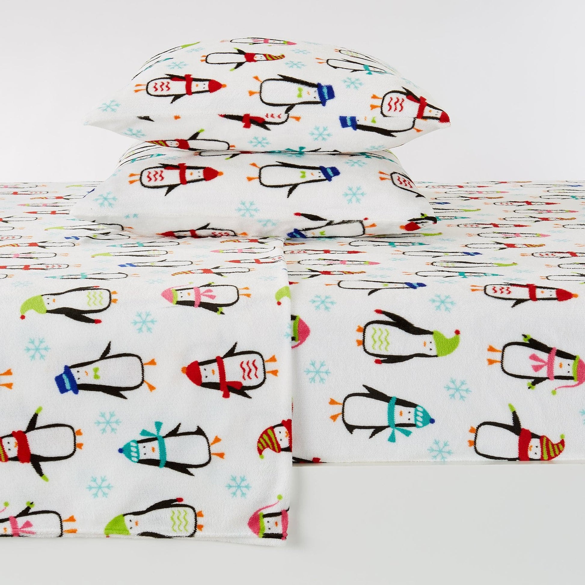 Sheet set with colorful penguin design on a white background