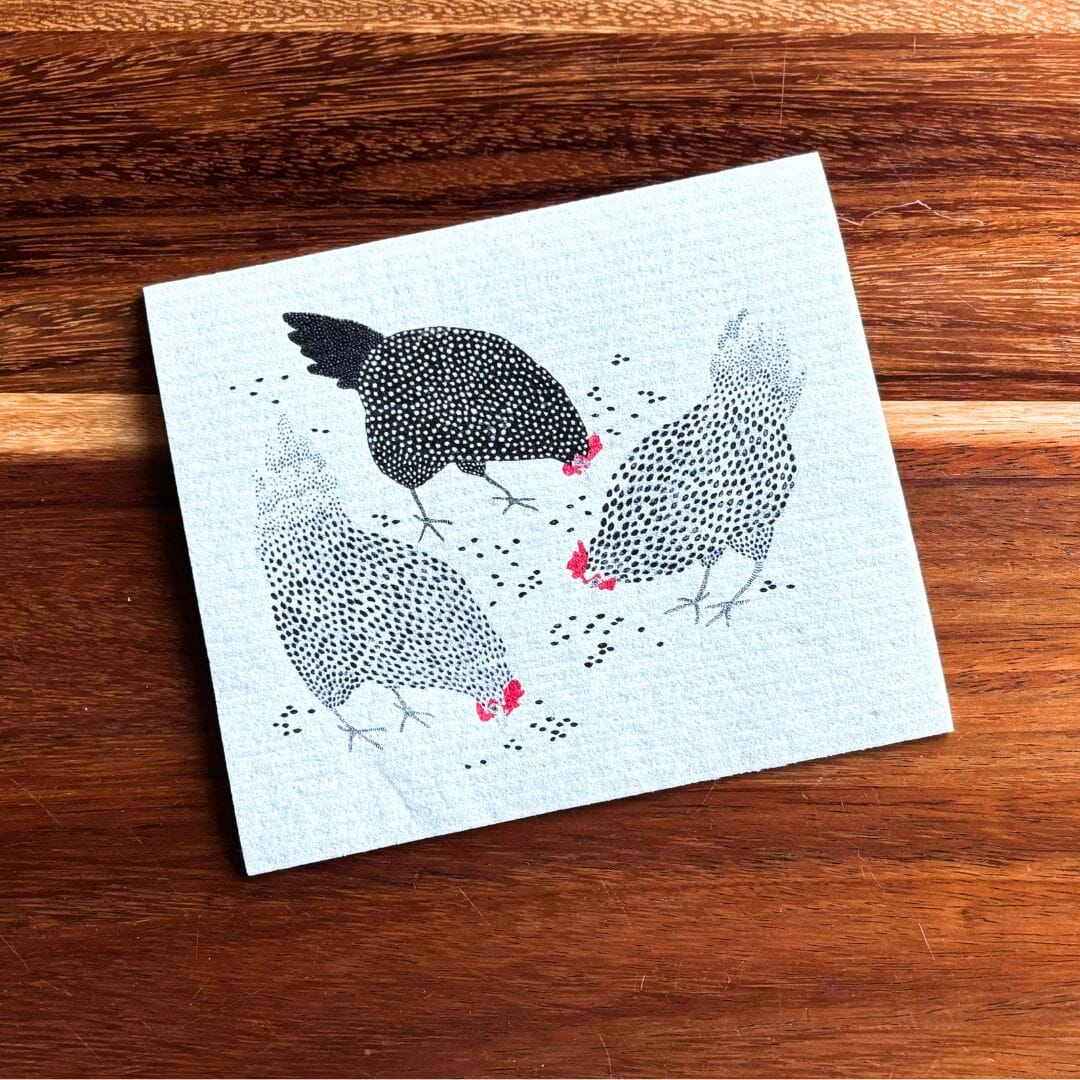 Card with chicken illustration on a wooden surface