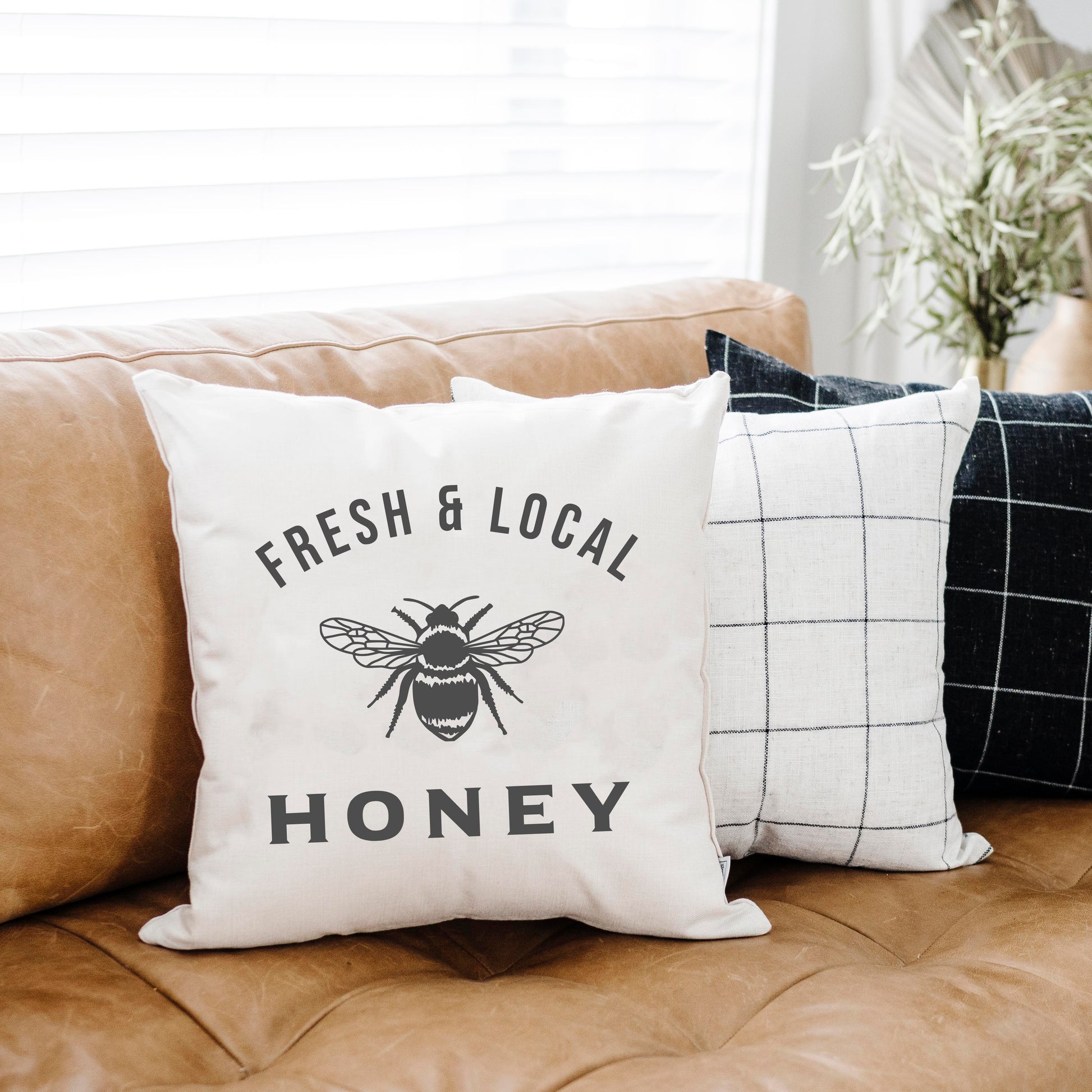 Local Honey Summer Pillow Cover 18x18 inch on a couch with text Fresh & Local Honey