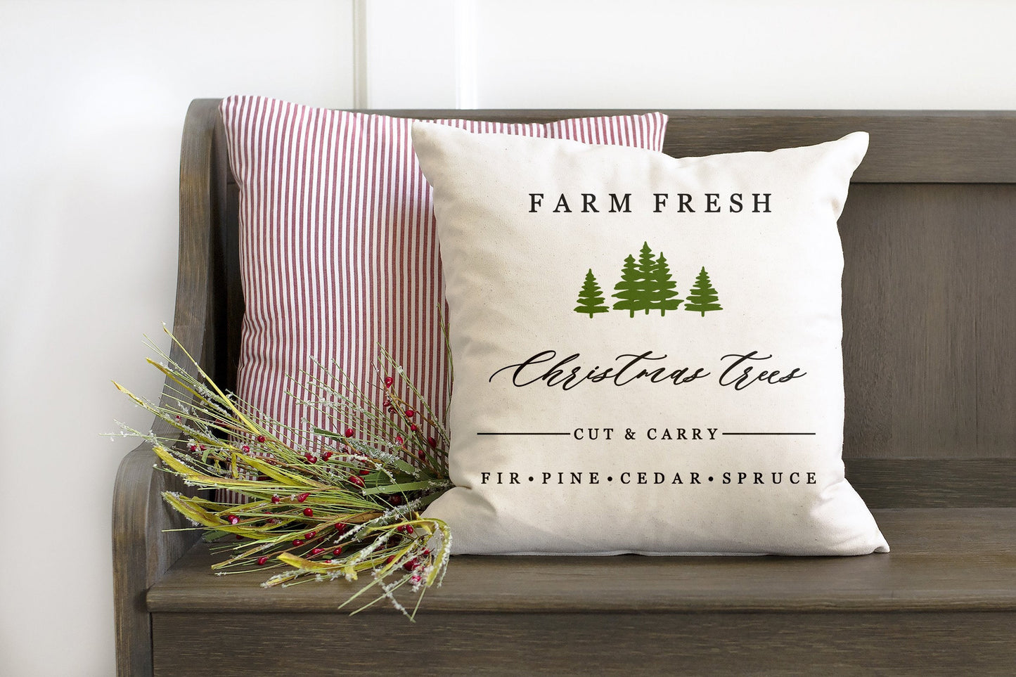 Farm Fresh Christmas Trees 18x18 inch Pillow Cover on a rustic bench with greenery accents.