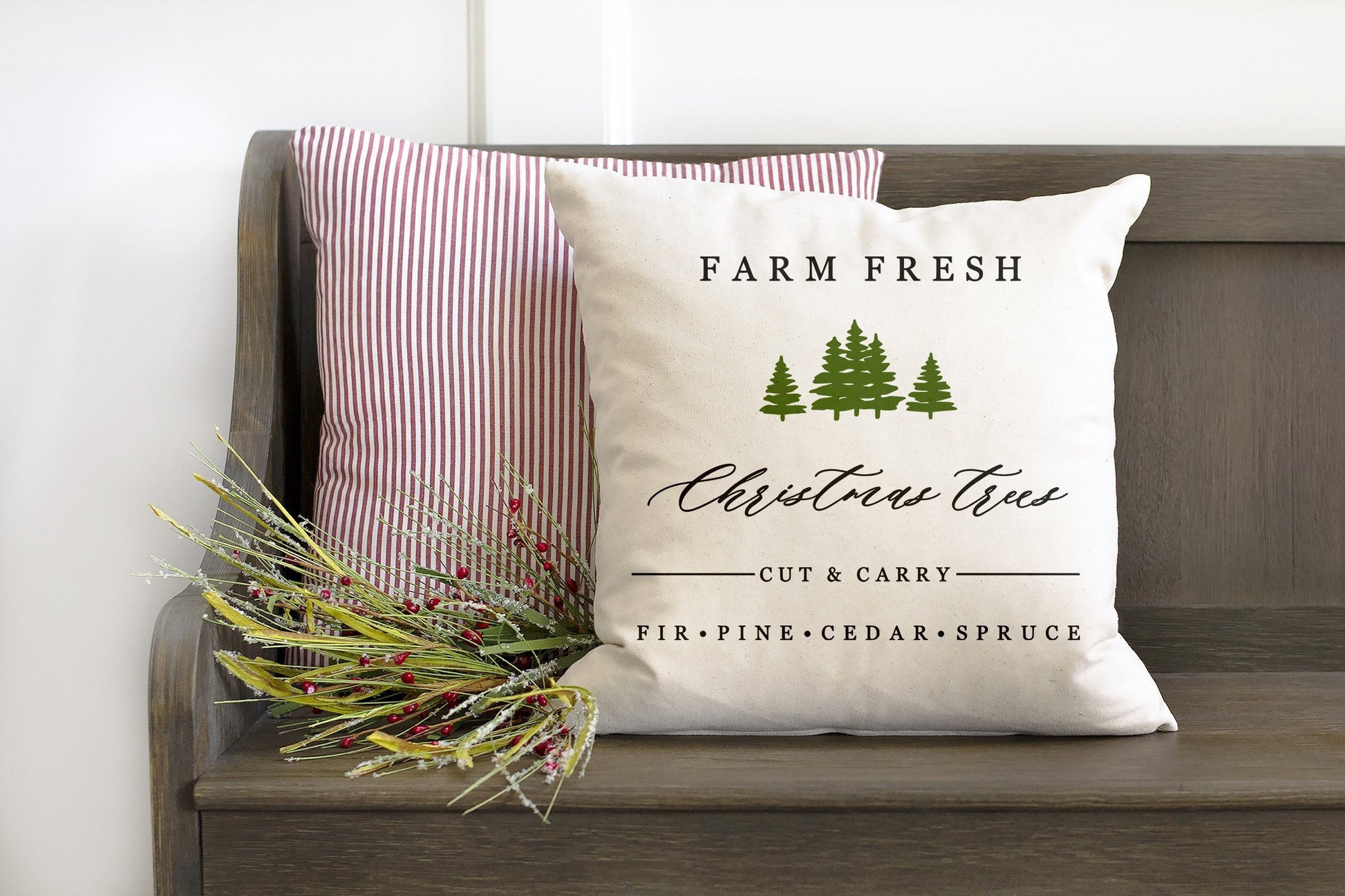 Farm Fresh Christmas Trees 18x18 inch Pillow Cover on a rustic bench with greenery accents.