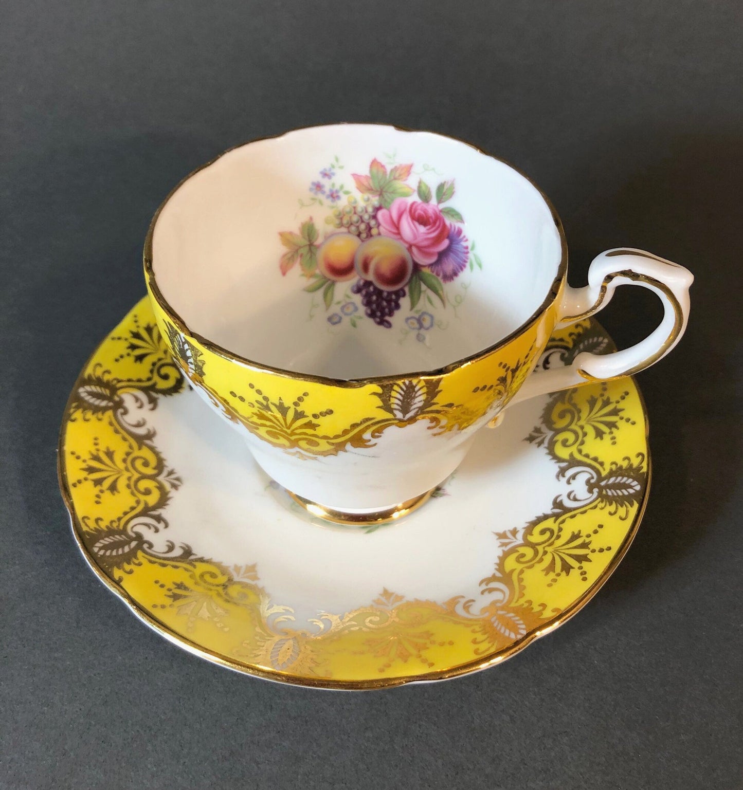 Tea Cup and Saucer by Paragon Made in England in Yellow, Gold, Pink.