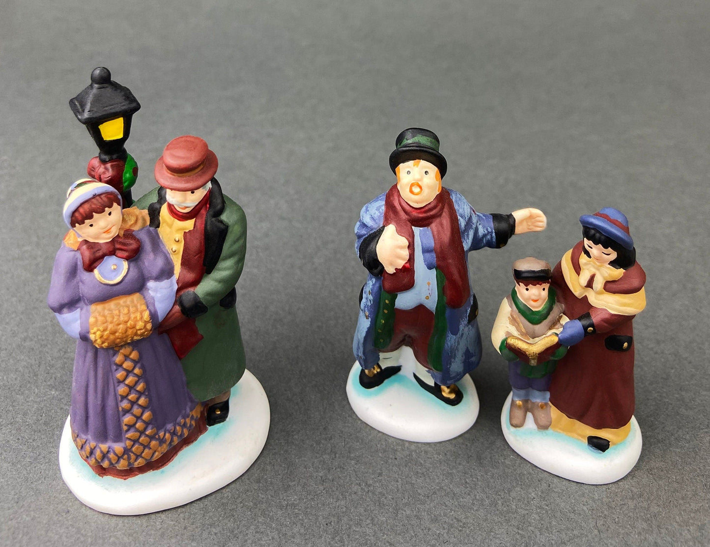 Village Accessories by Department 56.  Town Square Carolers.  Handpainted Set of Three Porcelain Figurines.  Heritage Village Collection.