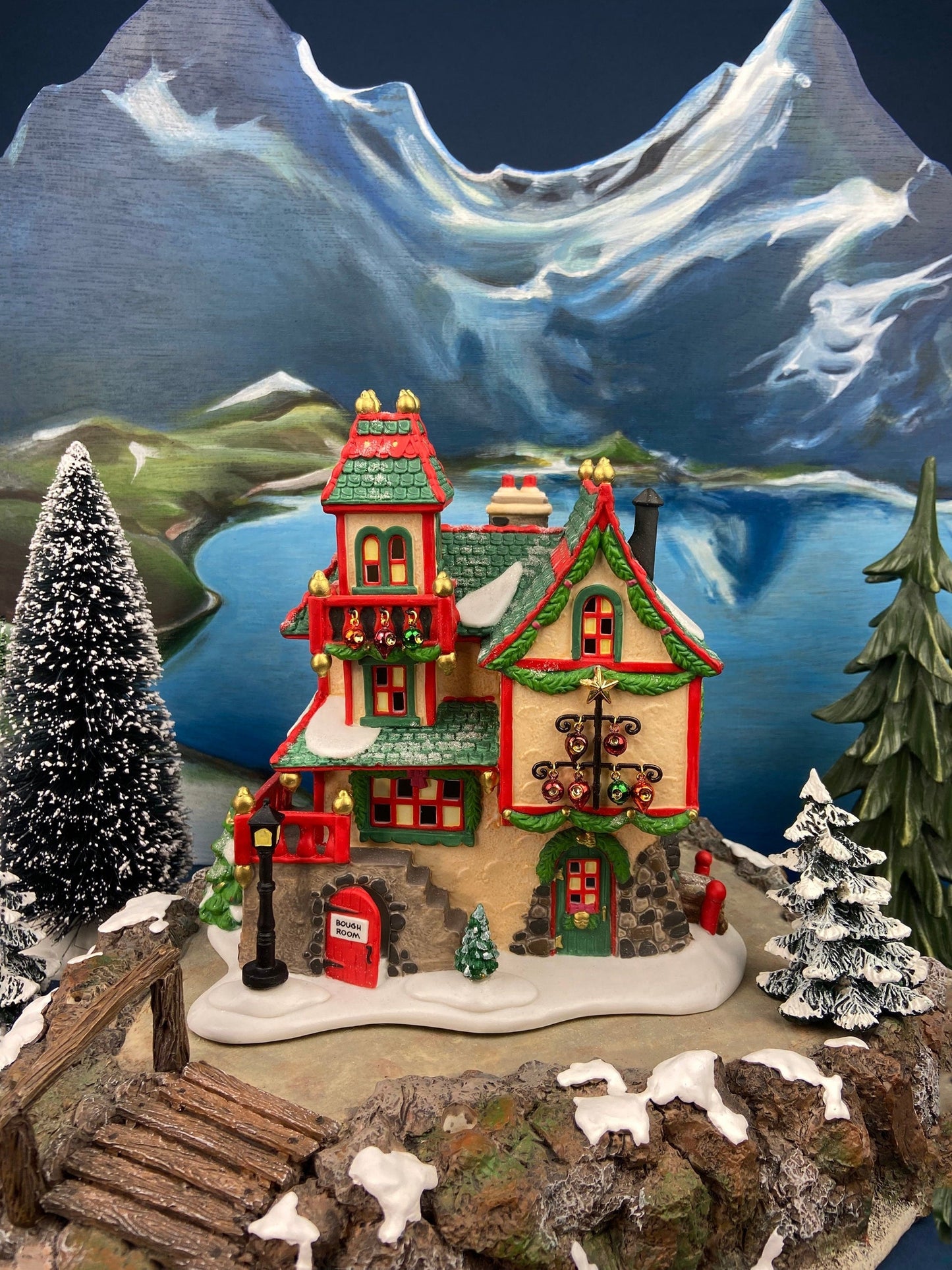 Illuminated Christmas Village House. Glass Ornament Works by Department 56. North Pole Series. Holiday Decor. Christmas Celebration.