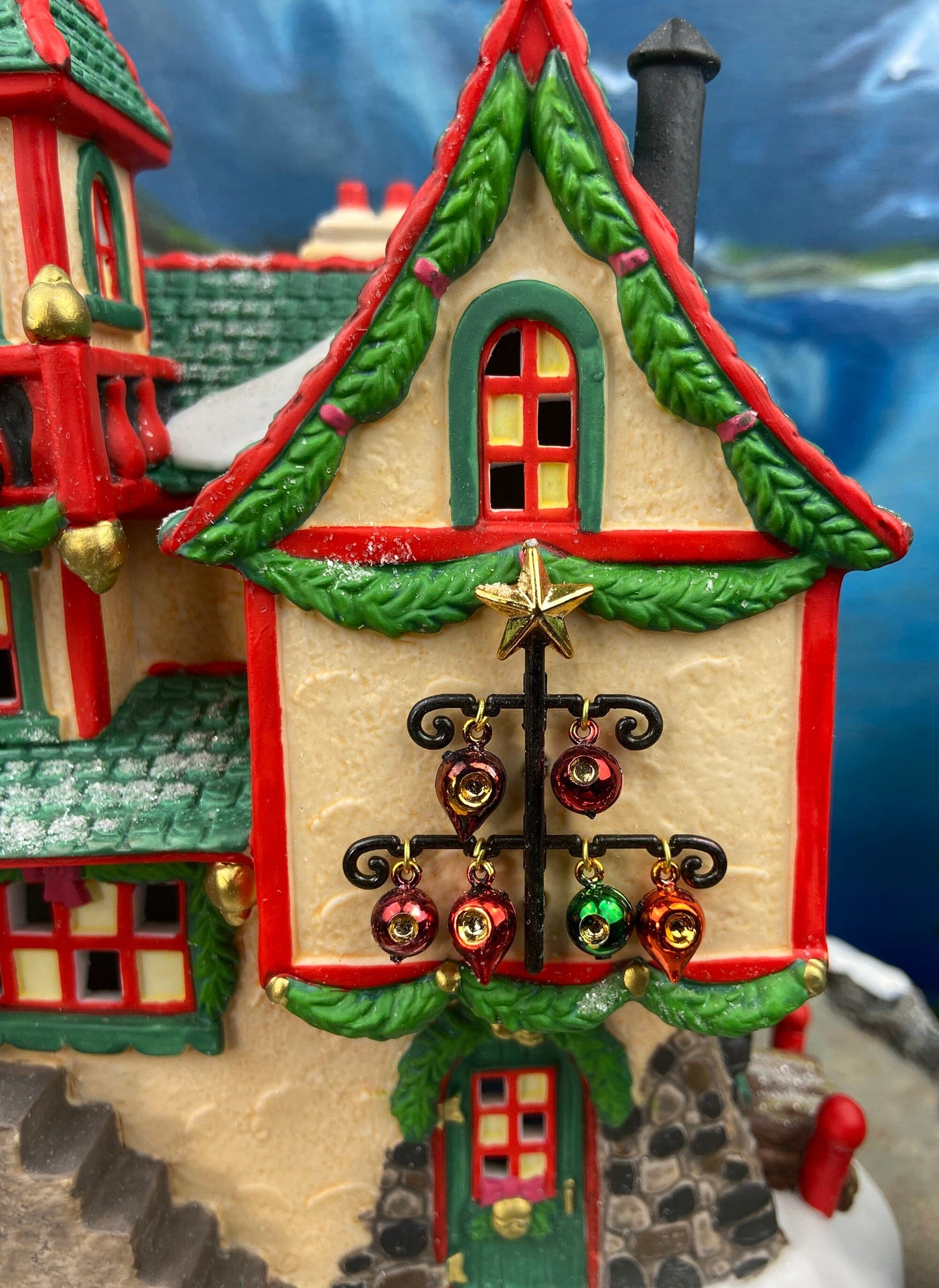 Illuminated Christmas Village House. Glass Ornament Works by Department 56. North Pole Series. Holiday Decor. Christmas Celebration.