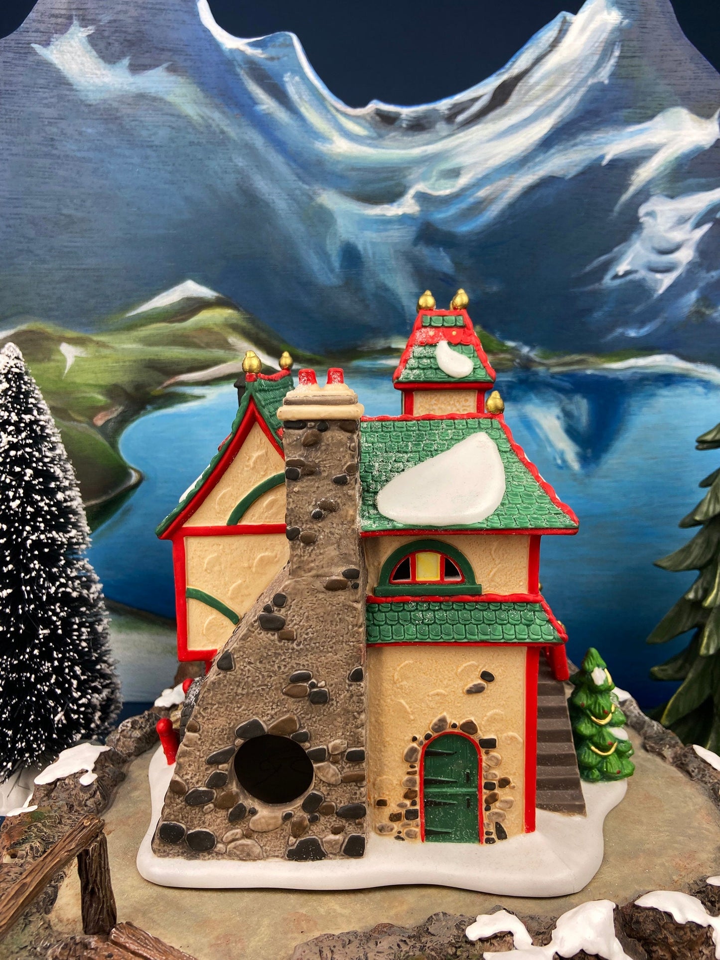 Illuminated Christmas Village House. Glass Ornament Works by Department 56. North Pole Series. Holiday Decor. Christmas Celebration.