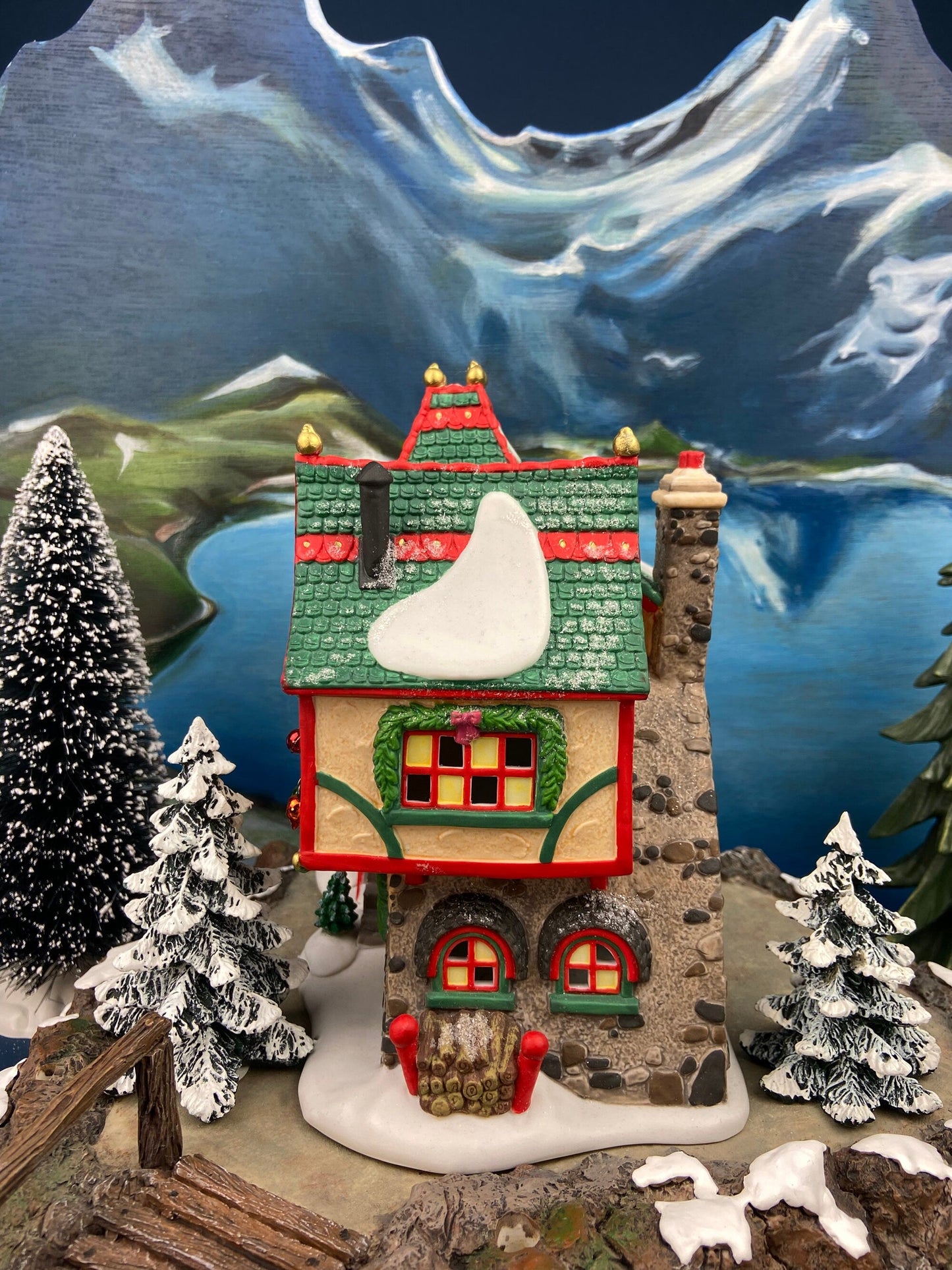 Illuminated Christmas Village House. Glass Ornament Works by Department 56. North Pole Series. Holiday Decor. Christmas Celebration.