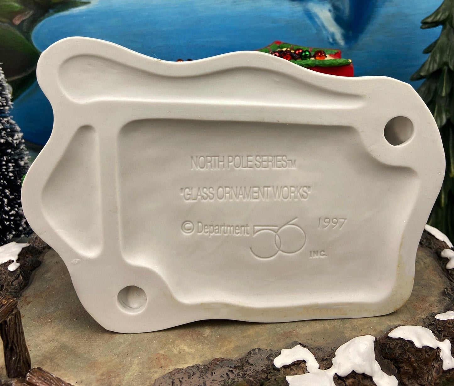 Illuminated Christmas Village House. Glass Ornament Works by Department 56. North Pole Series. Holiday Decor. Christmas Celebration.