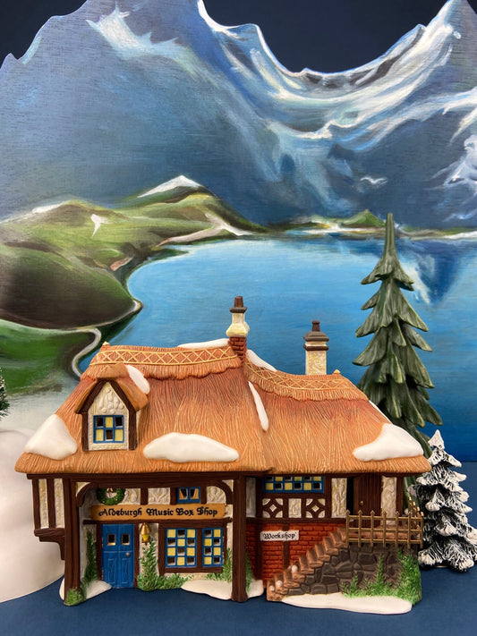 Illuminated Aldeburgh Music Box Shop. Celebrating Music. Christmas Village Porcelain House and Built-in Music Box. Dickens' Village Series.