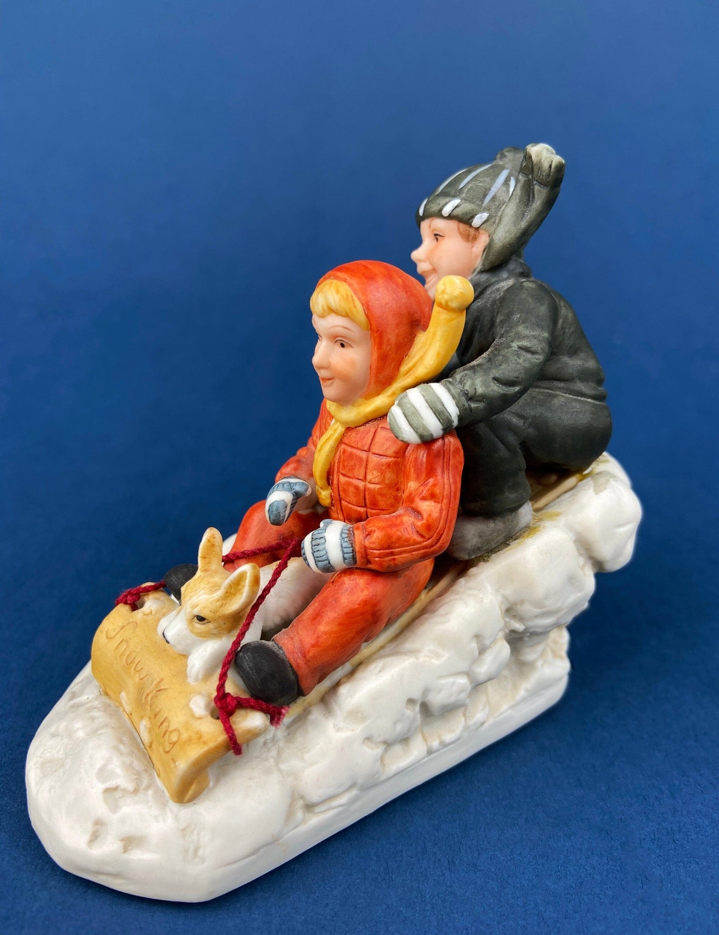 Kids & Dog on Sled Porcelain Figurine. Christmas. Downhill Racer. Inspired by Norman Rockwell. Museum Collections. Snow King. Collectibles.