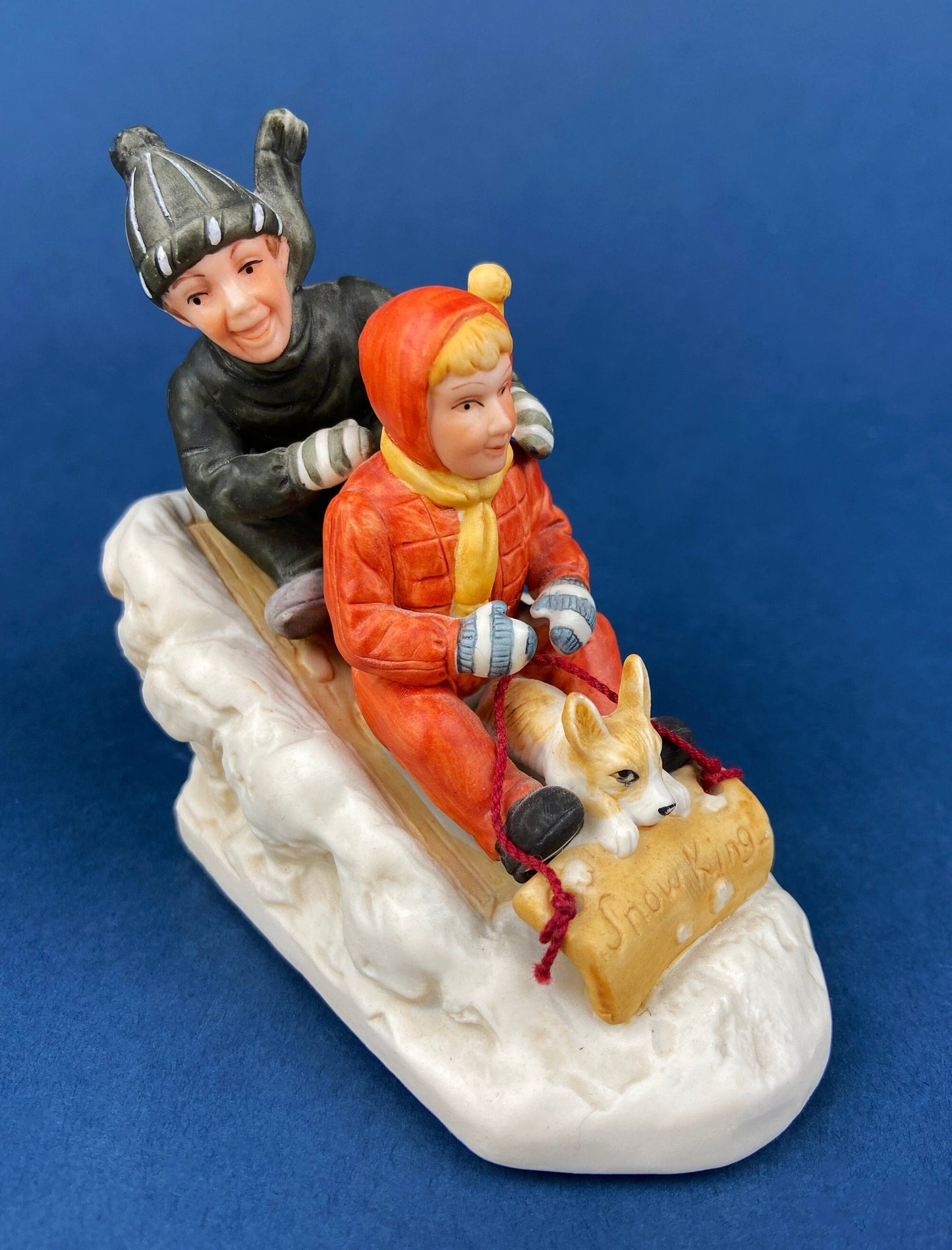 Kids & Dog on Sled Porcelain Figurine. Christmas. Downhill Racer. Inspired by Norman Rockwell. Museum Collections. Snow King. Collectibles.