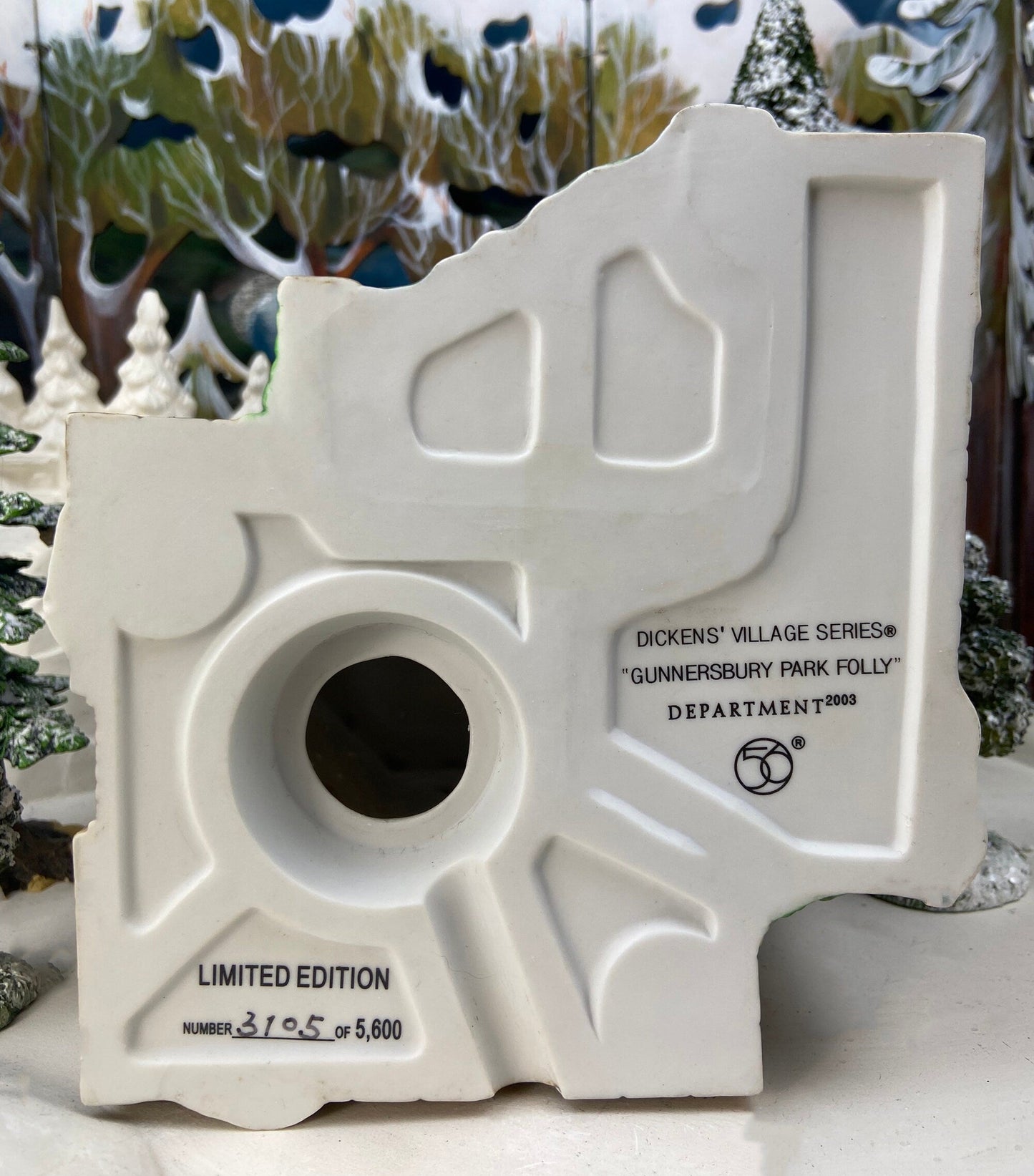 Decorative white structure with text and numbering, set against a festive background.