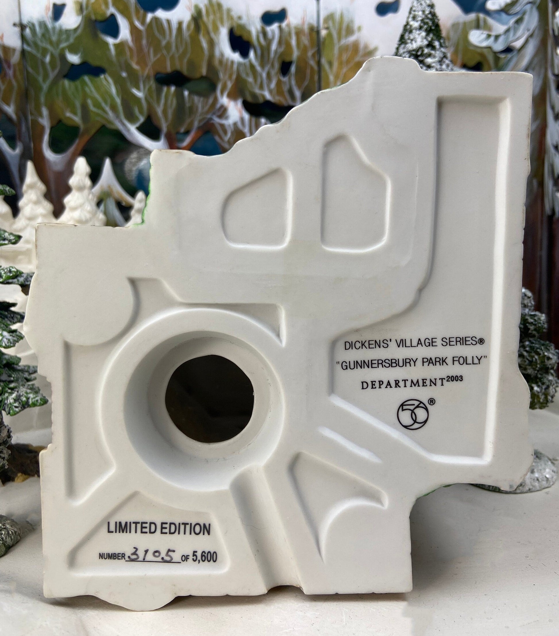 Decorative white structure with text and numbering, set against a festive background.