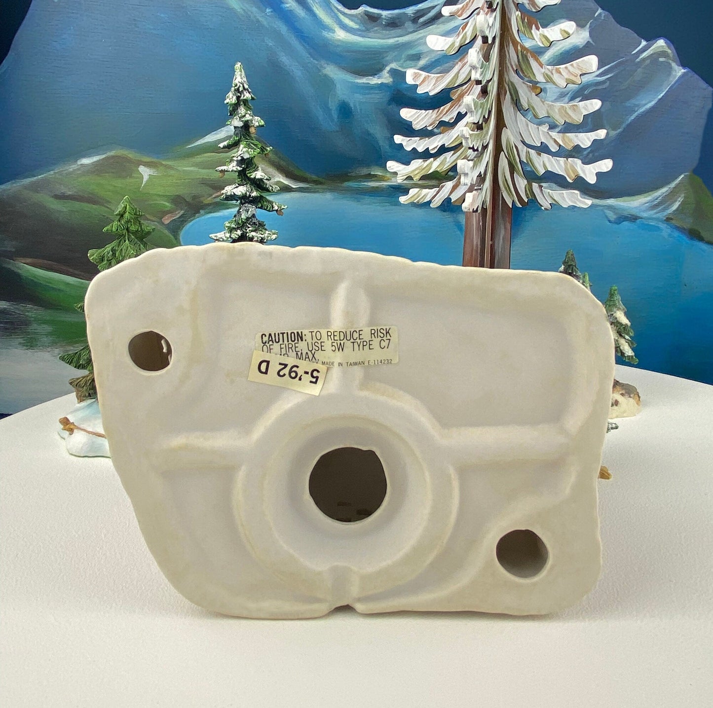 Christmas Village Farm House with Red Roof. Illuminated Building Holiday Decoration.