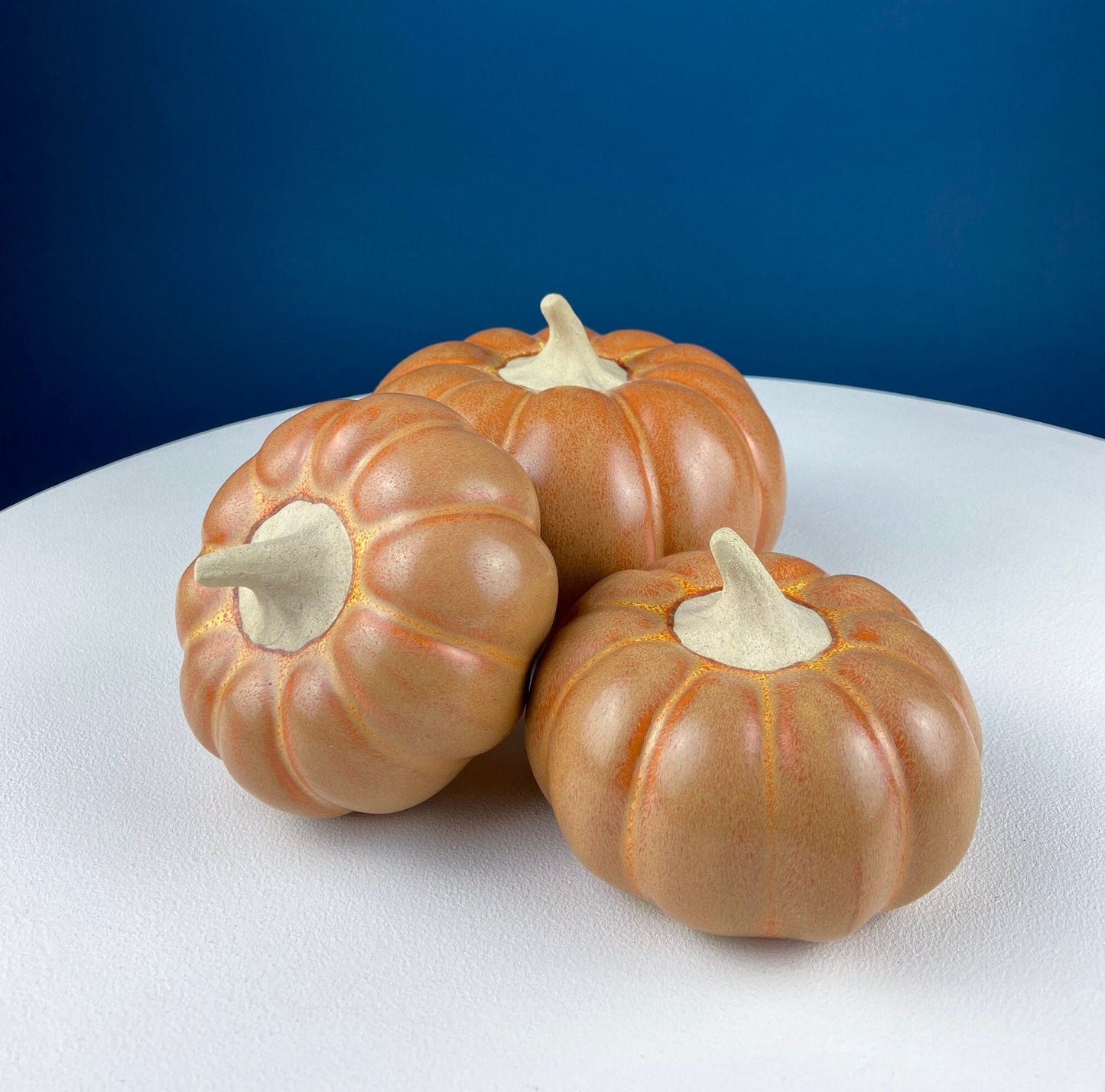 Set of Three Ceramic Pumpkins of Varying Sizes. One Large and Two Smaller. Staple Thanksgiving Fall Decoration. Home Decor. Store Display.