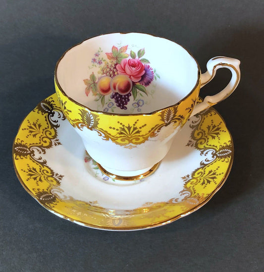 Tea Cup and Saucer by Paragon Made in England in Yellow, Gold, Pink.