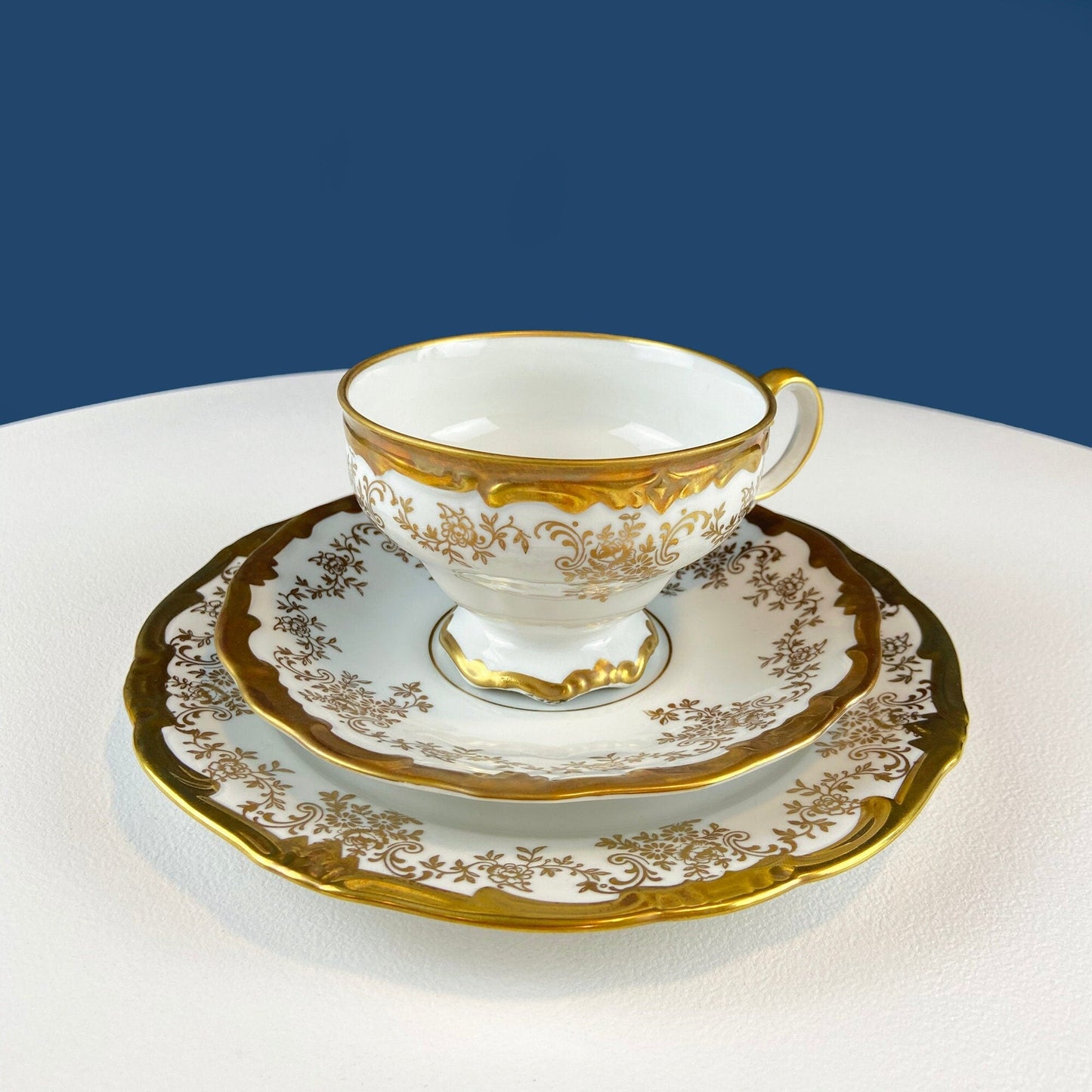 White and Gold Cup and Saucer. Paragon Porcelain, By Appointment to Her Majesty the Queen Potters. Dining Room Cabinet Display.