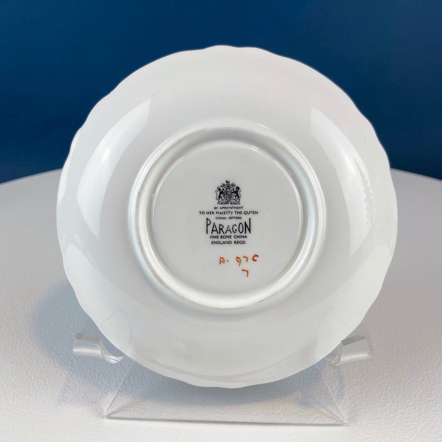 White and Gold Cup and Saucer. Paragon Porcelain, By Appointment to Her Majesty the Queen Potters. Dining Room Cabinet Display.