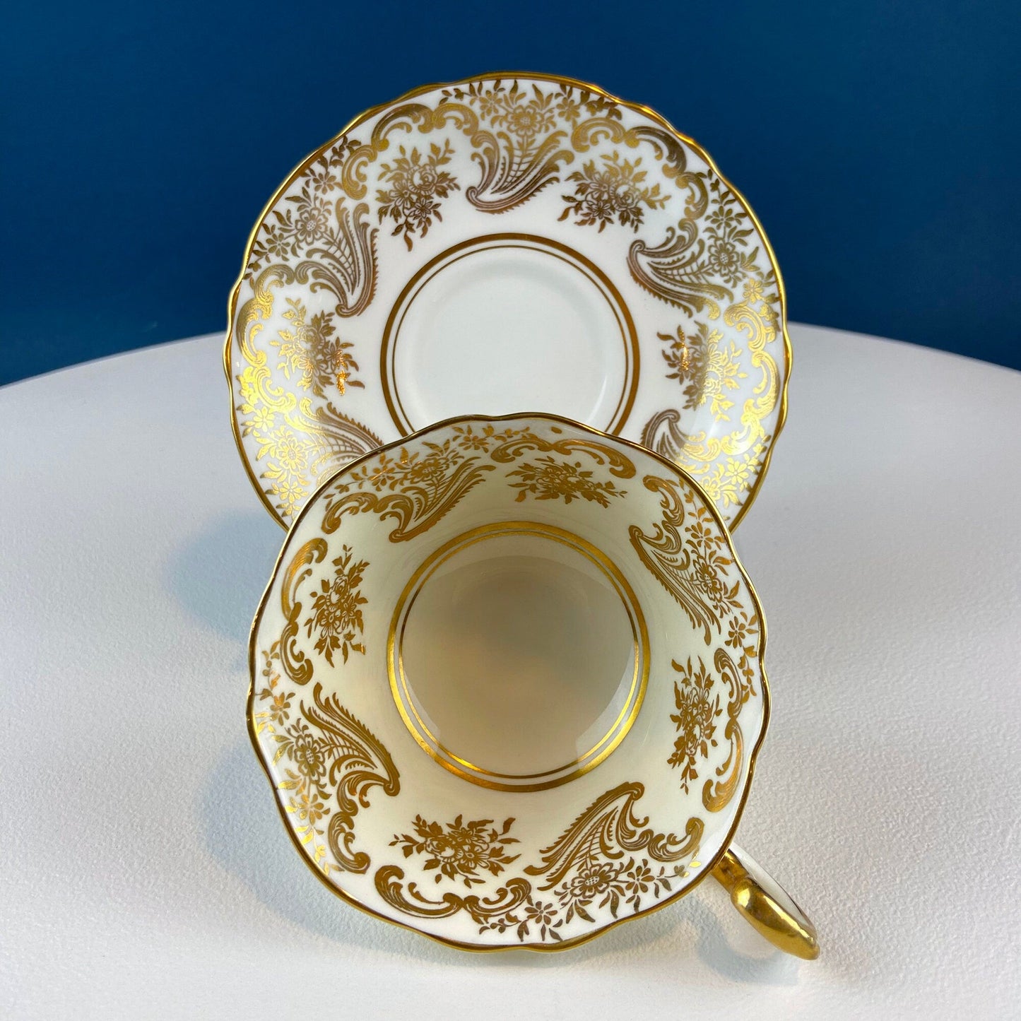 White and Gold Cup and Saucer. Paragon Porcelain, By Appointment to Her Majesty the Queen Potters. Dining Room Cabinet Display.