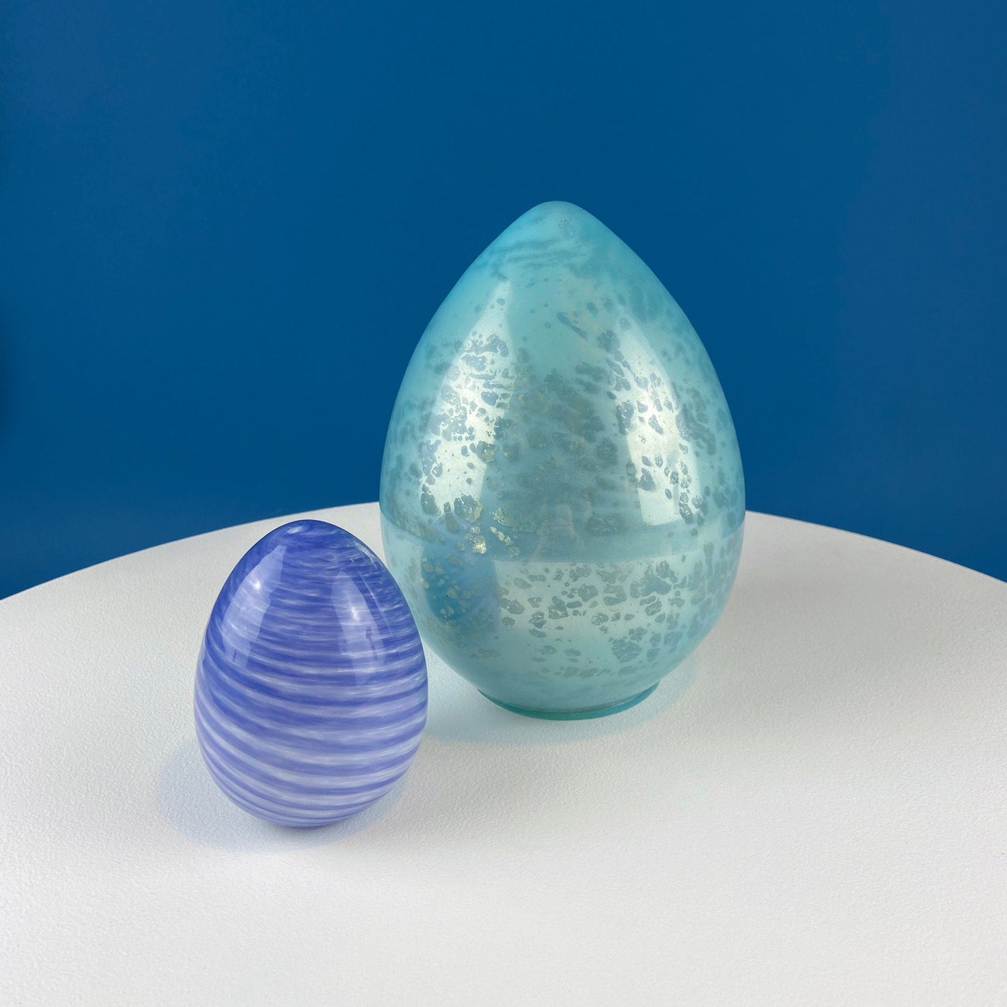 Set of Two Glass Eggs. Large Textured Blue and Smaller Purple with Swirl Embedded in Glass. Easter or Spring Decor. Dining Room Decor.