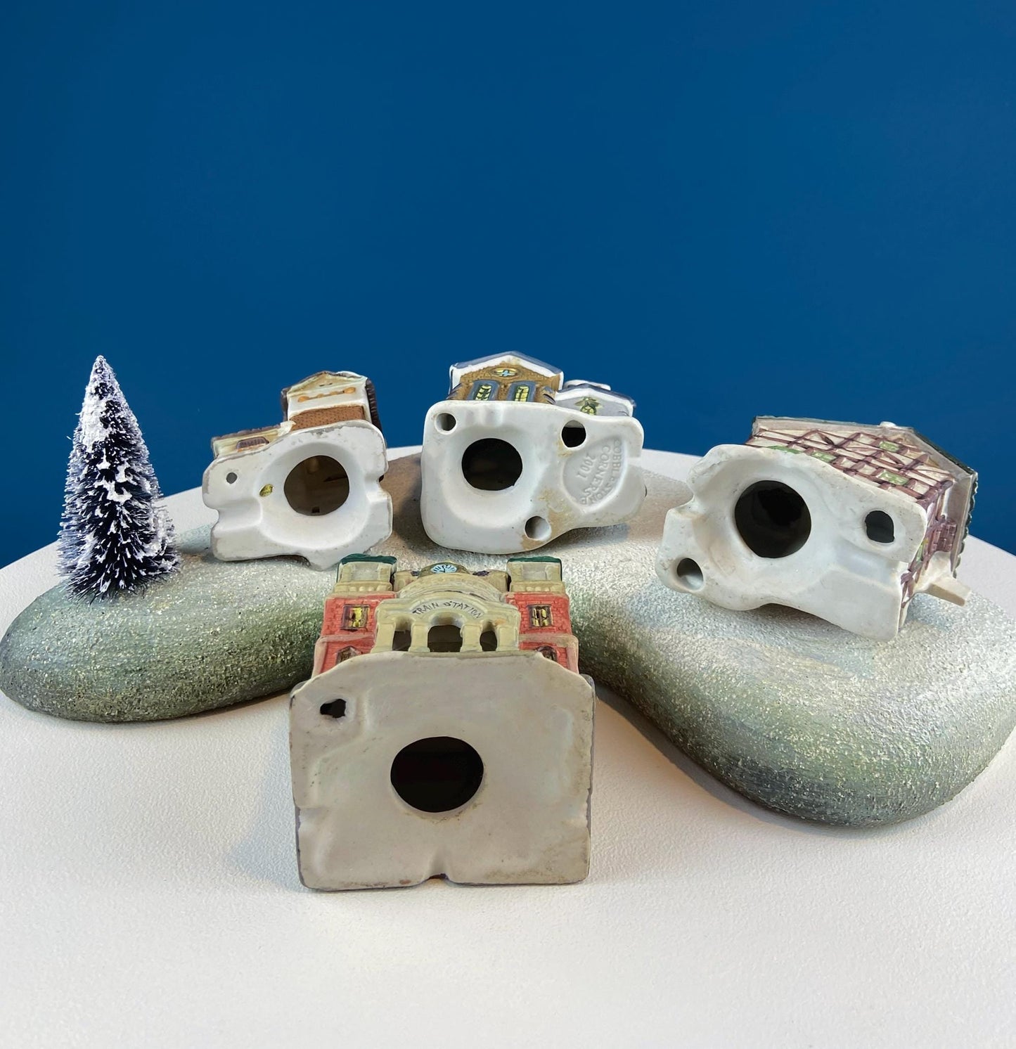 Christmas Village Collection of Small Illuminated Houses. Set of 4 Bldgs: Mill, 2 Churches, Train St., Council Offices, 2 Sheep and 3 Pines.