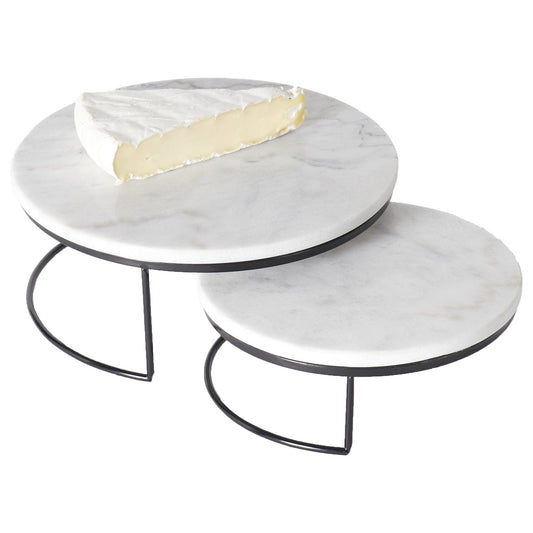 Two marble nesting tables with a white background
