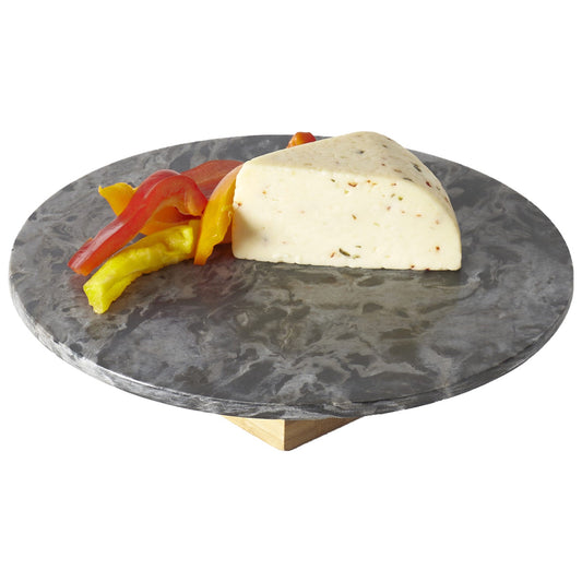 Marble cheese board with a wedge of cheese and sliced peppers on a white background