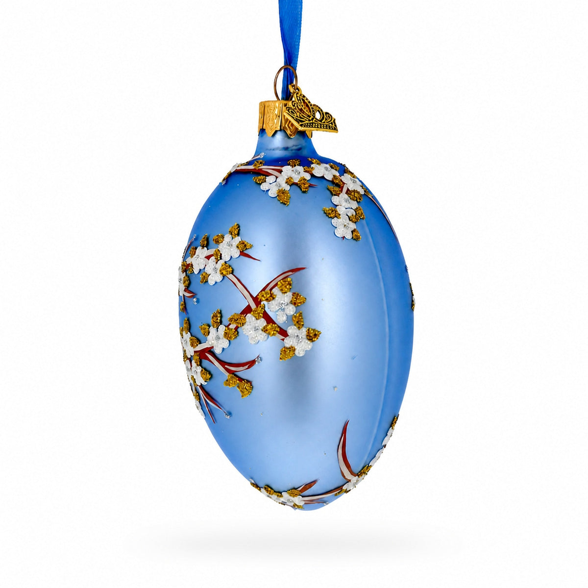 White Blossom Branch on Light Blue Glass Egg Ornament