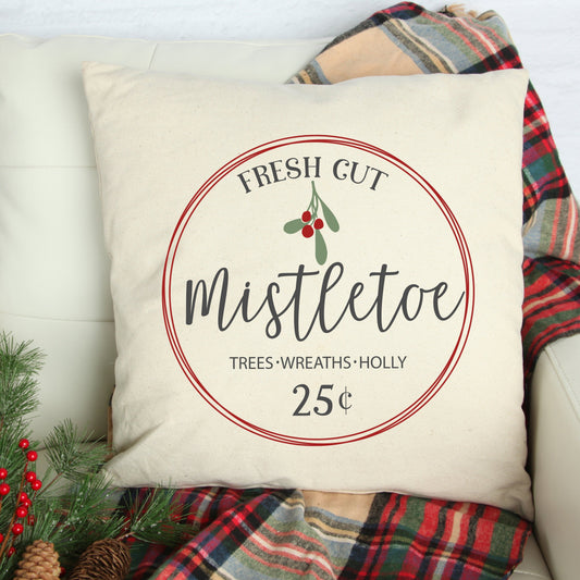 Fresh Cut Mistletoe Christmas Pillow Cover on a cozy couch with holiday decor.