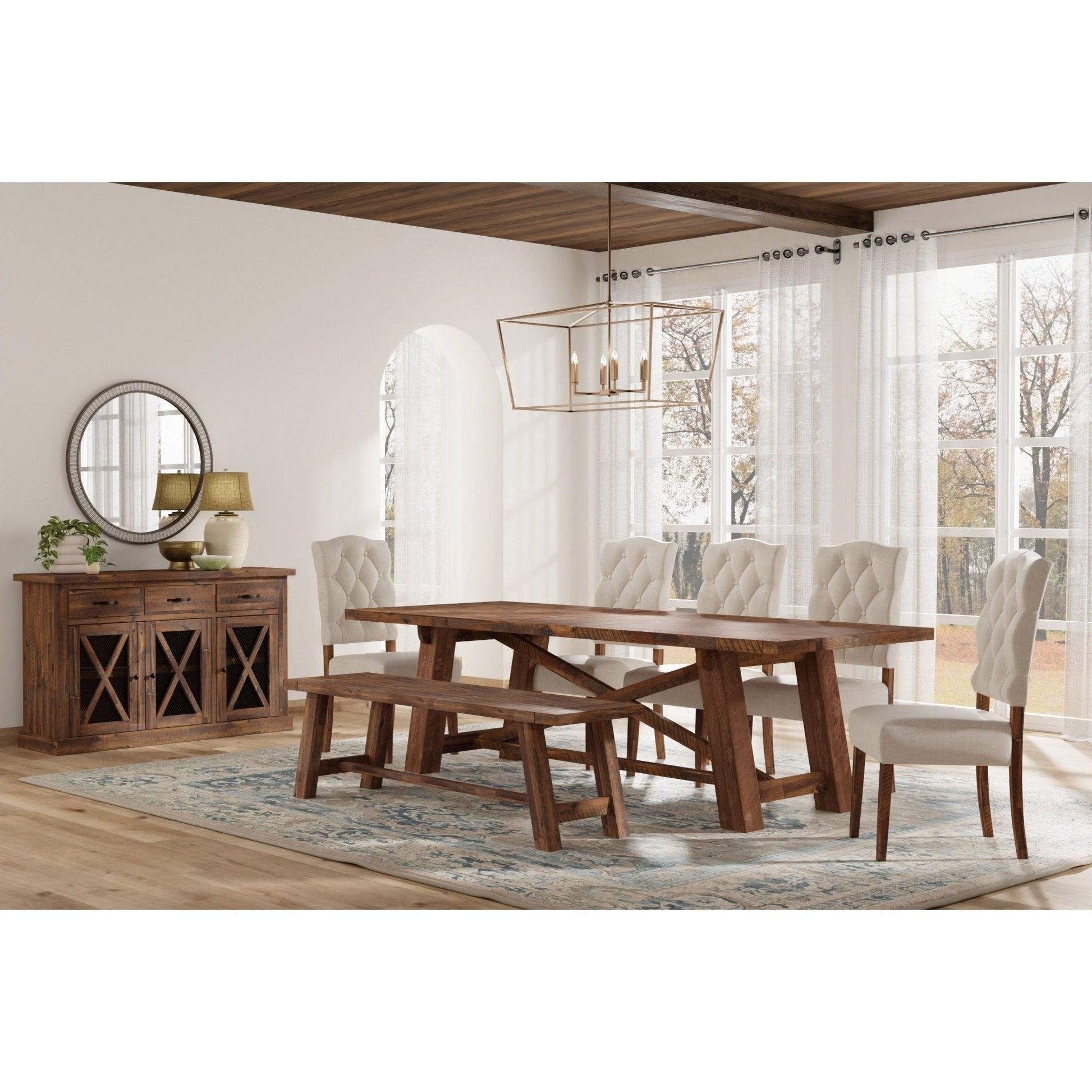 Newberry Bench in a rustic dining room setting with a medium brown wood finish and elegant decor.