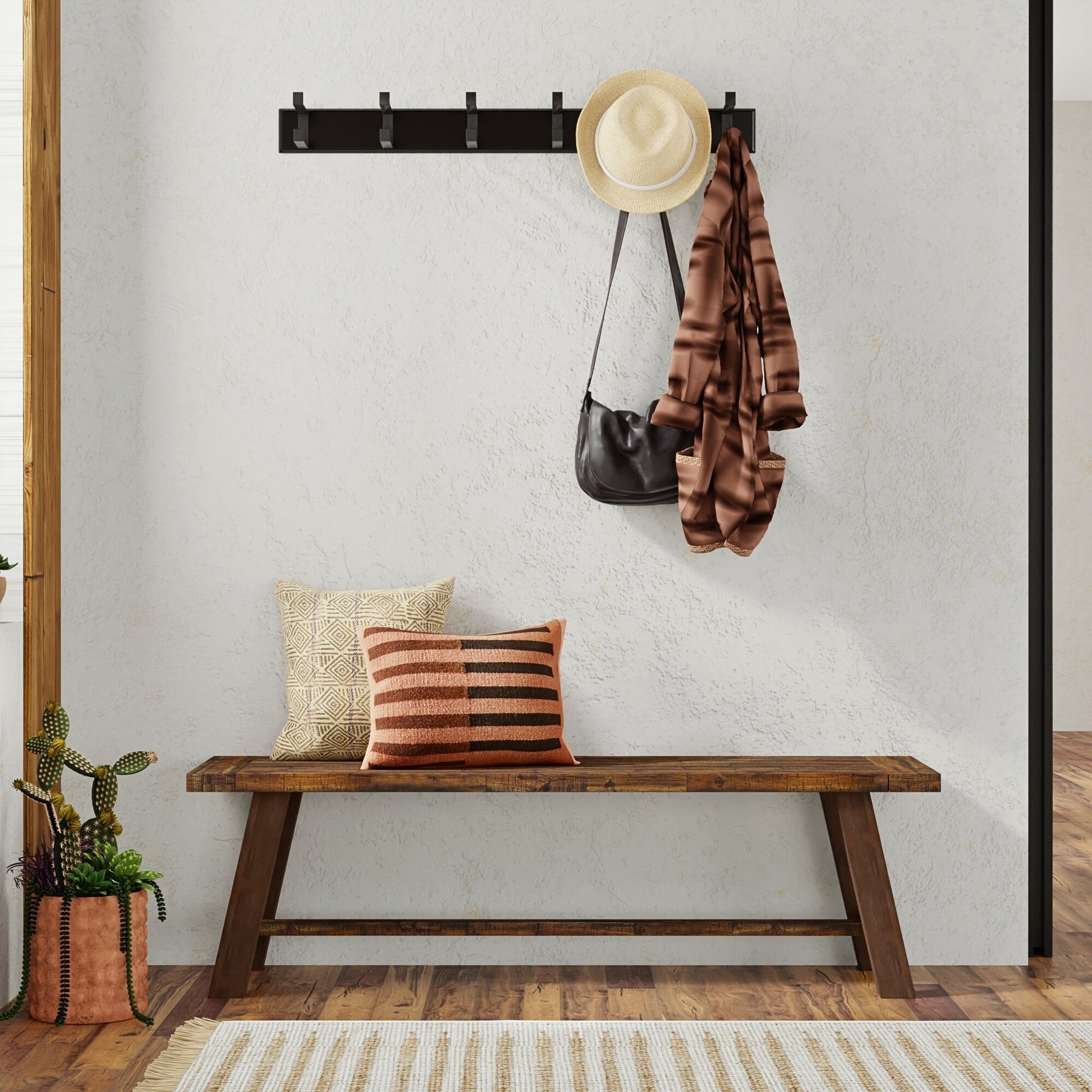 Newberry Bench, Medium Brown with cushions and accessories in a stylish entryway setting.