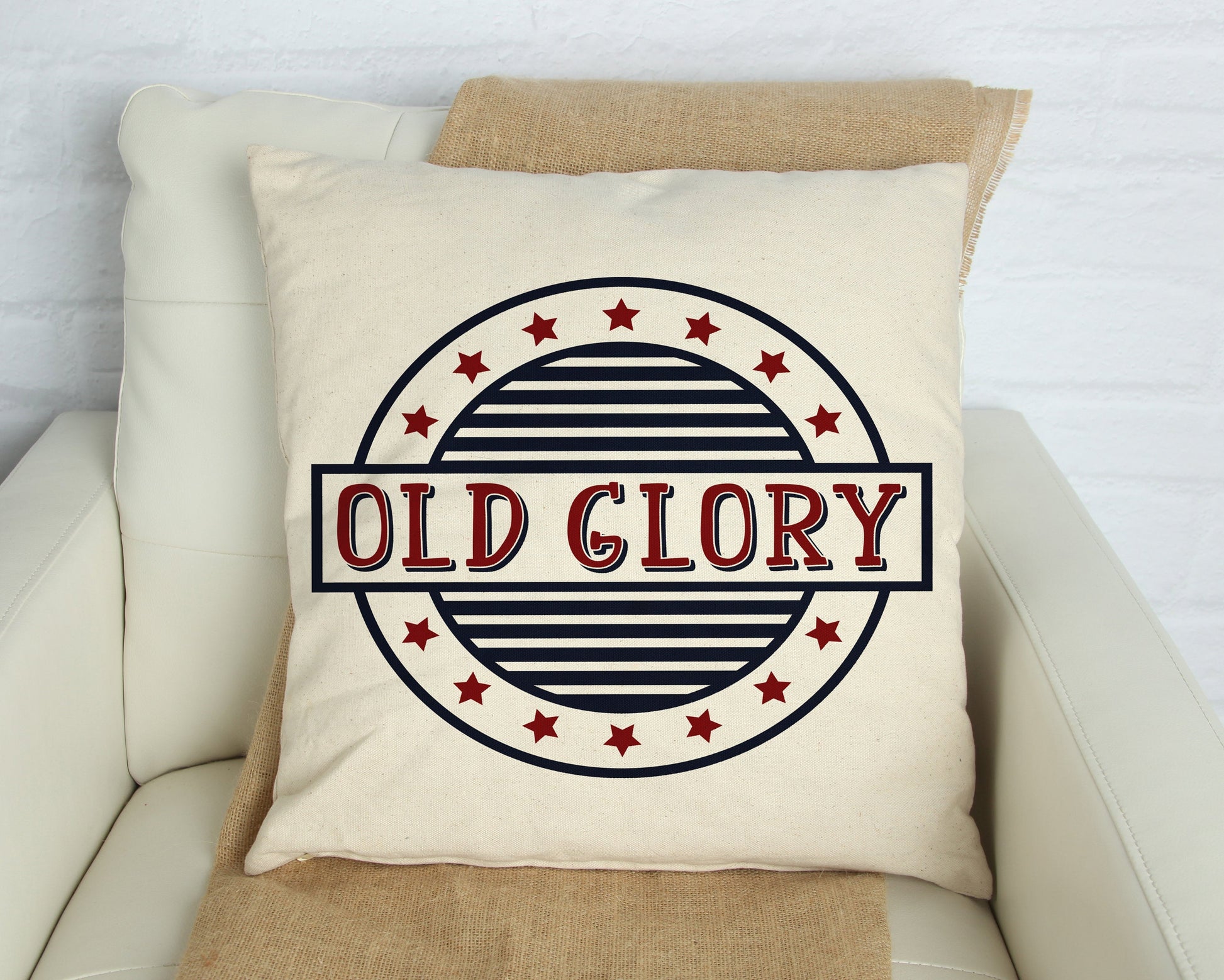Old Glory Independence Day Pillow Cover 18x18 inch with navy blue and dark red design on an oatmeal background.