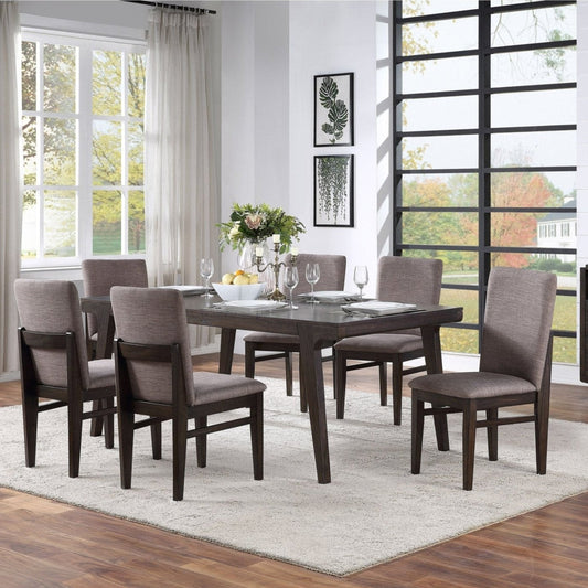 Olejo Dining Table in a beautifully styled dining room with modern chairs and decor.