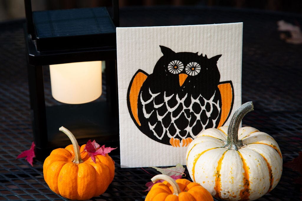 Owl Swedish Dishcloth design featuring an orange and black owl with pumpkins and a lantern in a fall setting.
