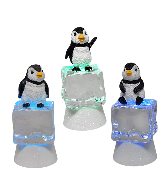 Penguin Sitting on Color-changing Lighted Icecube -