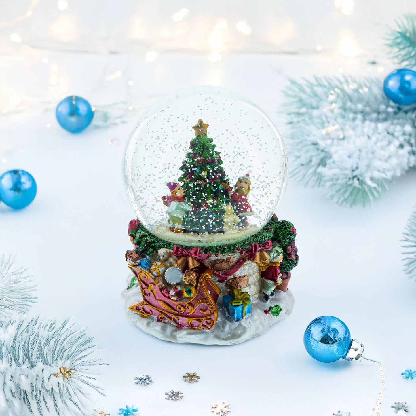 Joyful Children Adorning Christmas Tree: Musical Water Snow Globe