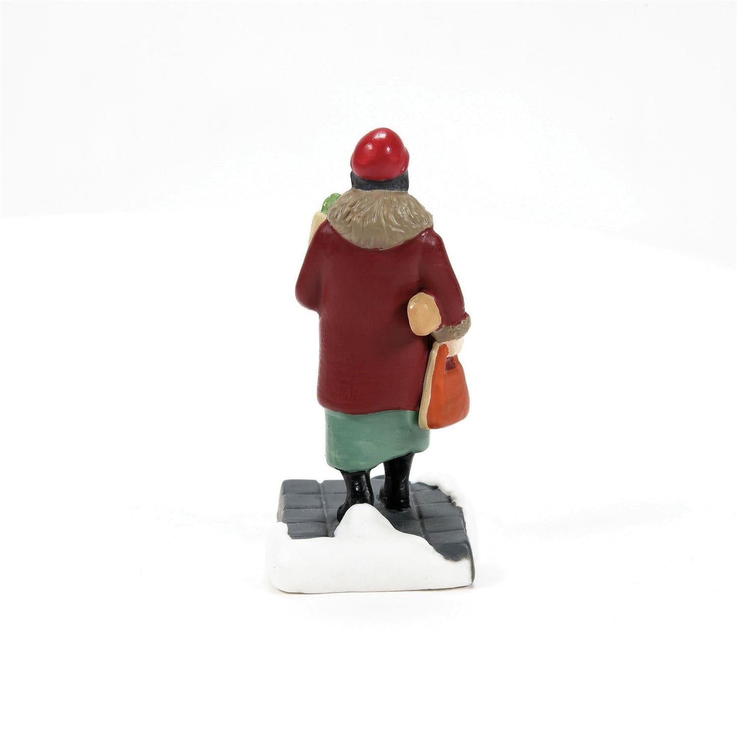 Back view of a porcelain figurine from the Friends And Neighbors - 3 Piece Set wearing a red coat and hat.