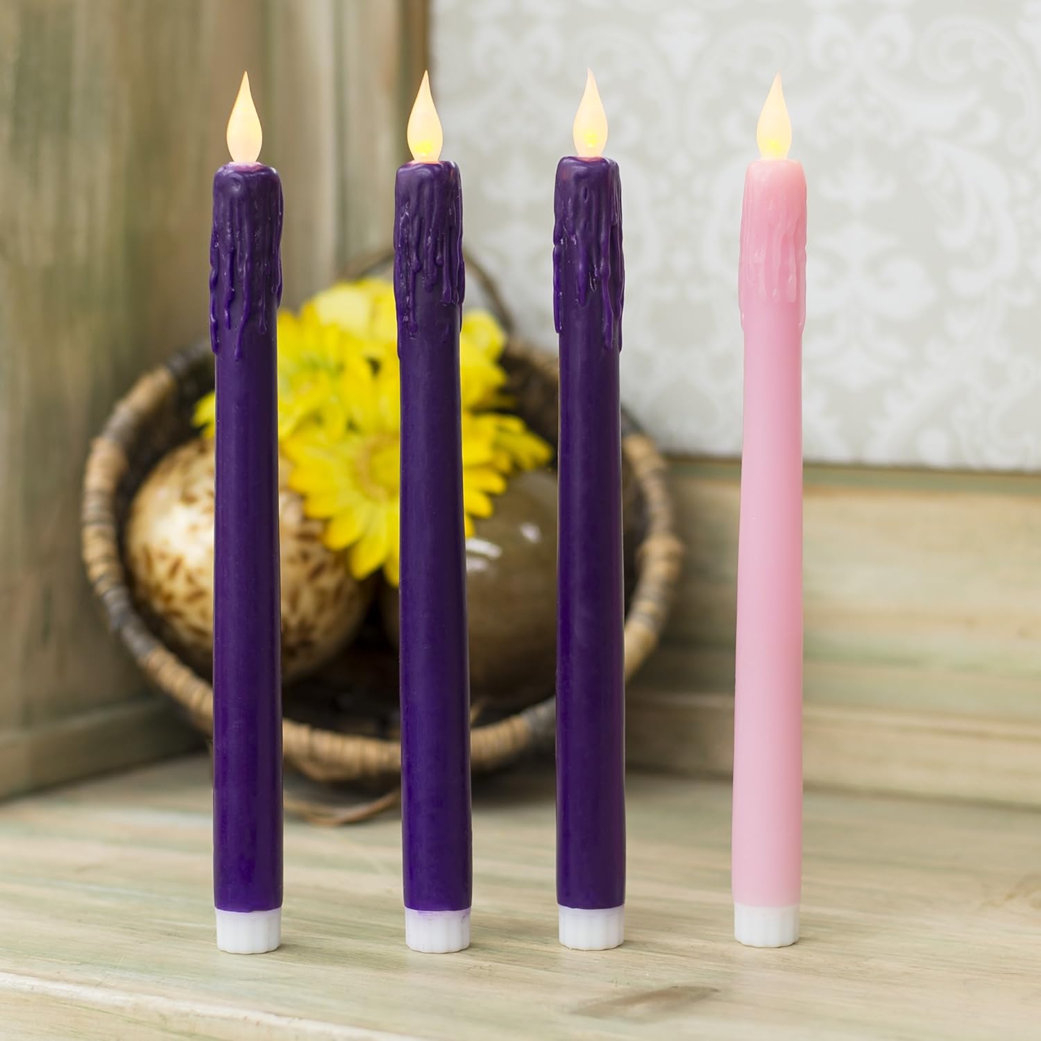 LED Advent Candle Set - 10 Inch - 4-piece featuring three purple and one pink candle with illuminated tips.