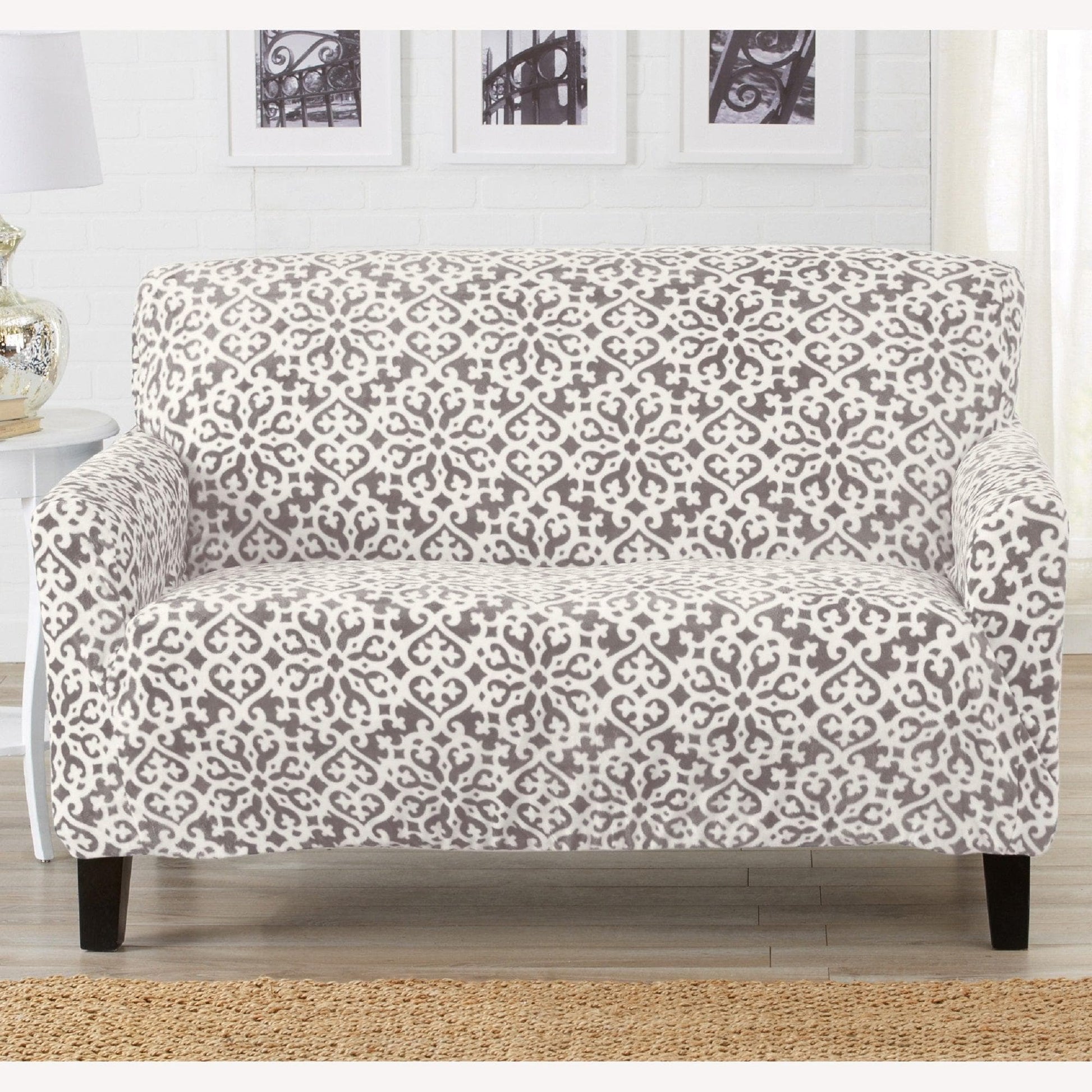 Patterned sofa cover on a couch in a living room setting
