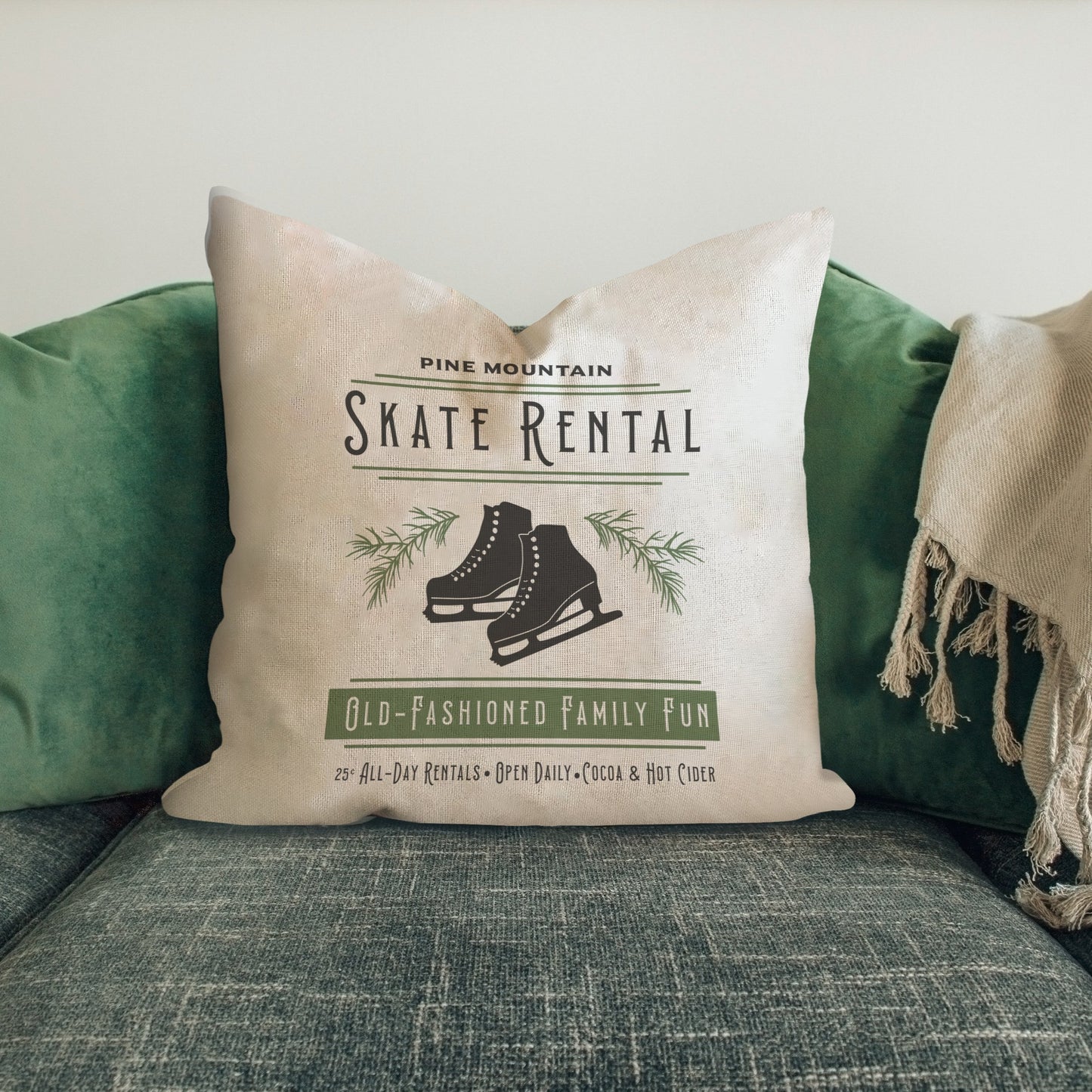 Skate Rental Pillow Cover featuring vintage ice skates design on a cozy couch with green cushions.
