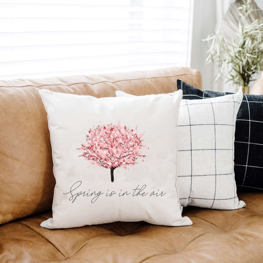 Cherry Blossom Tree Pillow Cover 18x18 inch on a couch, perfect for spring decor accents.